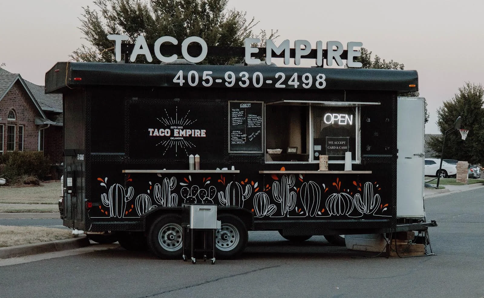 Taco Empire food truck with open sign and cactus artwork