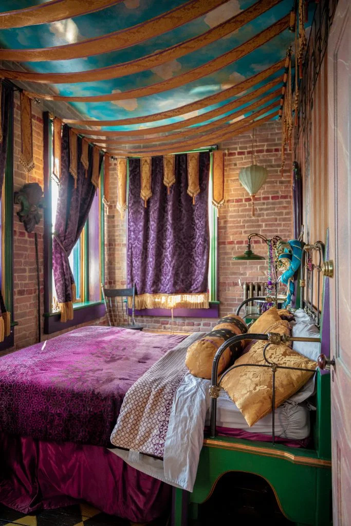Colorful bedroom with ornate decor and rich fabrics