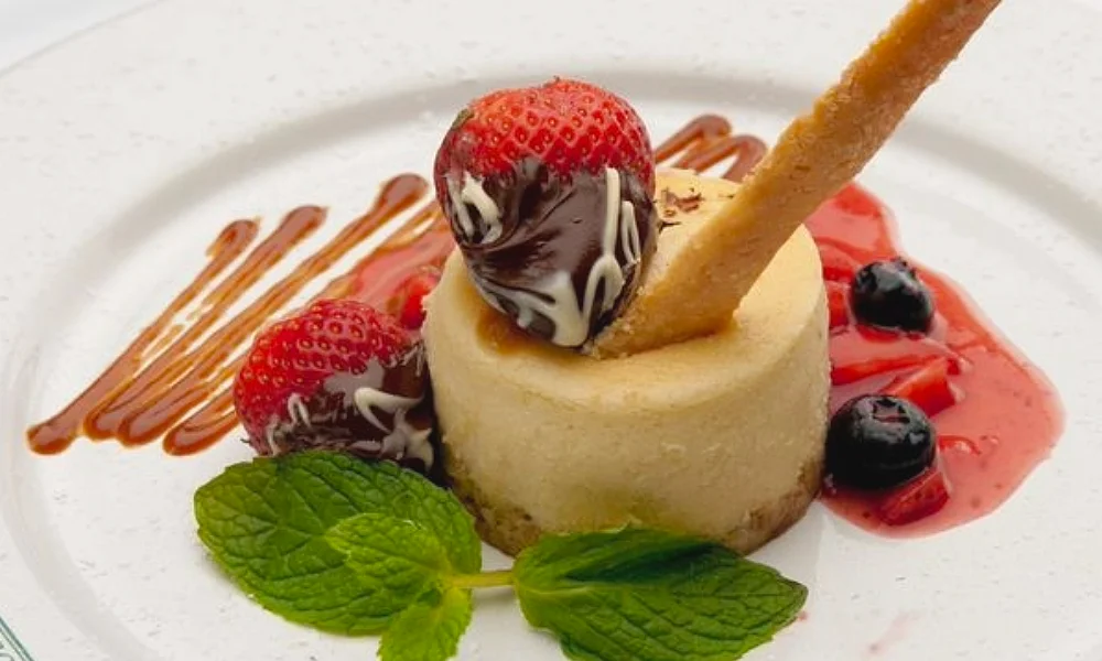Slice of creamy New York-style cheesecake served at Post Oak Grill Downtown Houston.