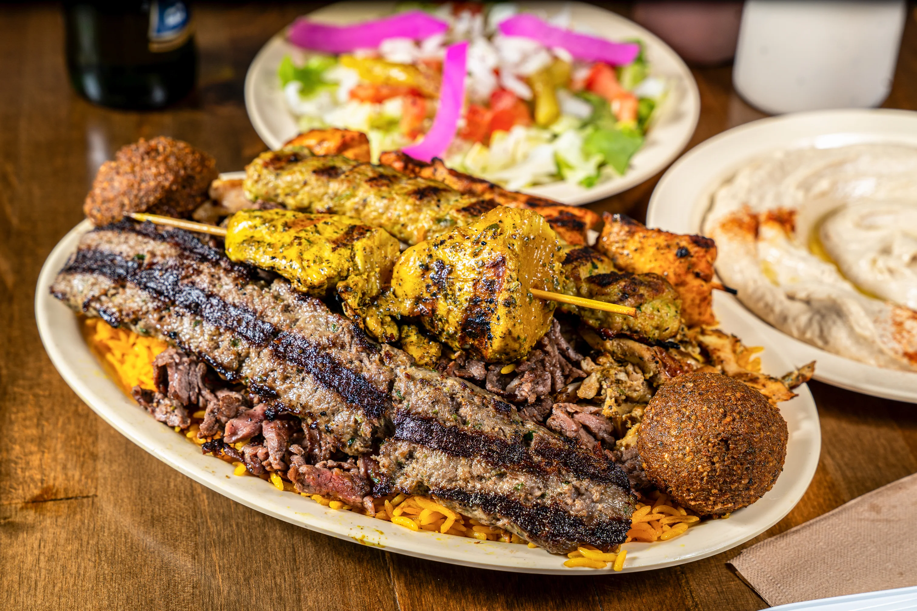 Pita Zone kabab and shawarma plate with rice, salad, and hummus
