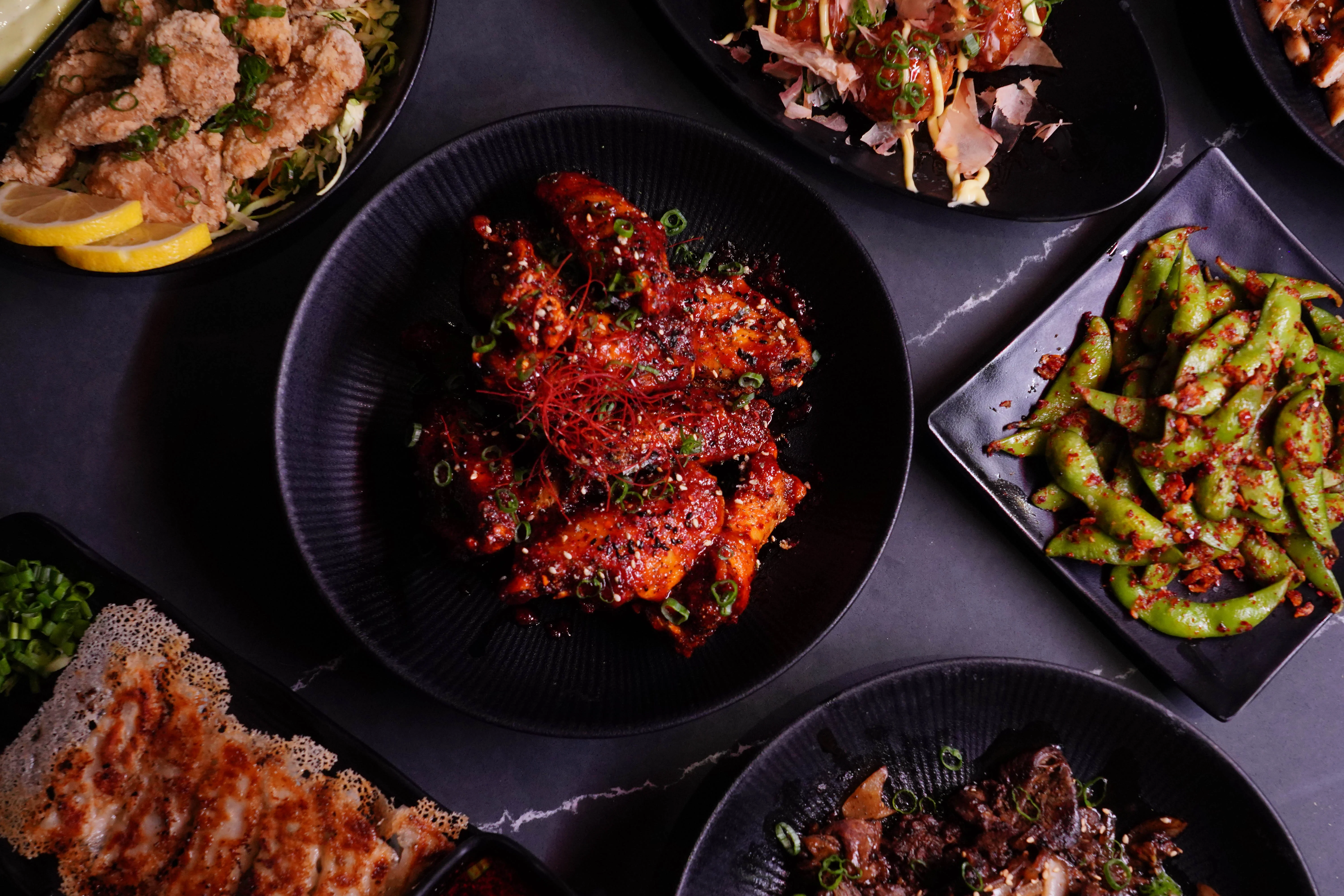 Korean spicy chicken wings garnished with scallions
