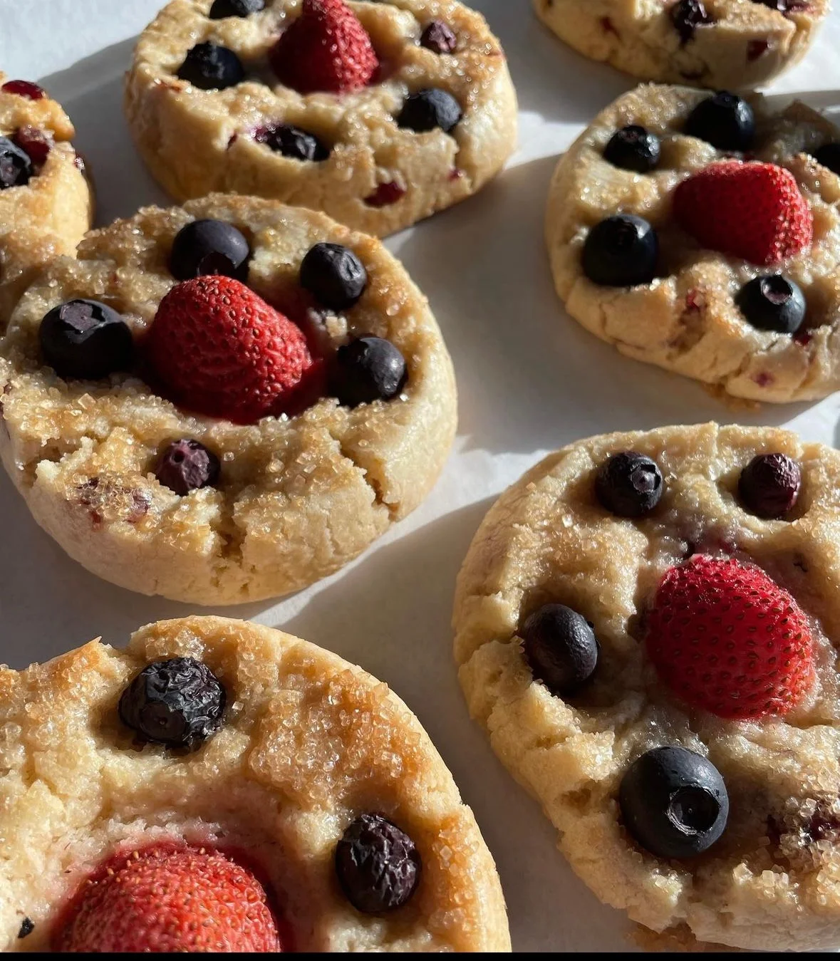Freshly baked berry cookies with strawberries and blueberries