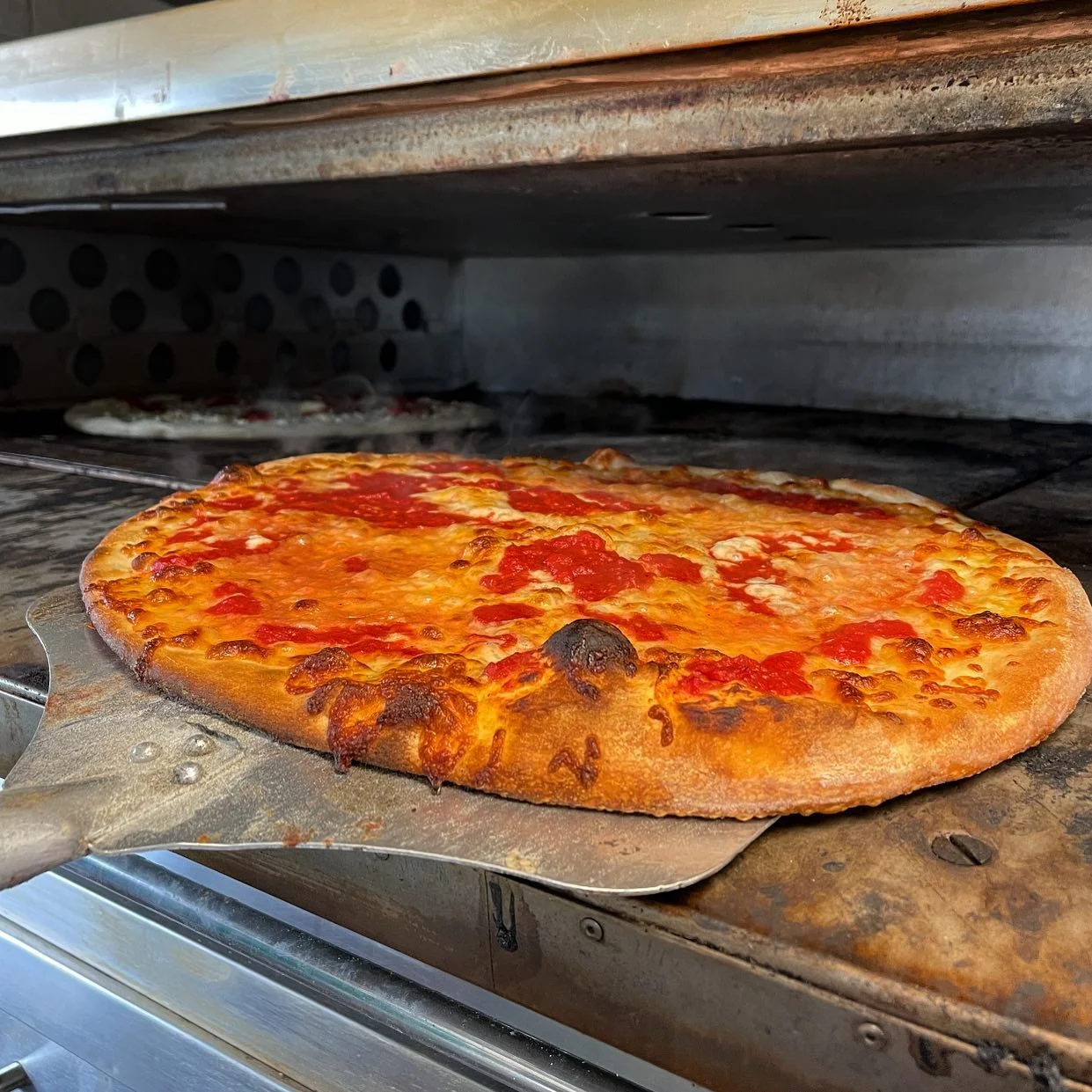 Margherita pizza fresh from a wood-fired oven