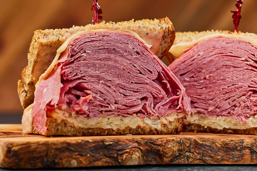 Stacked corned beef sandwich on rye bread