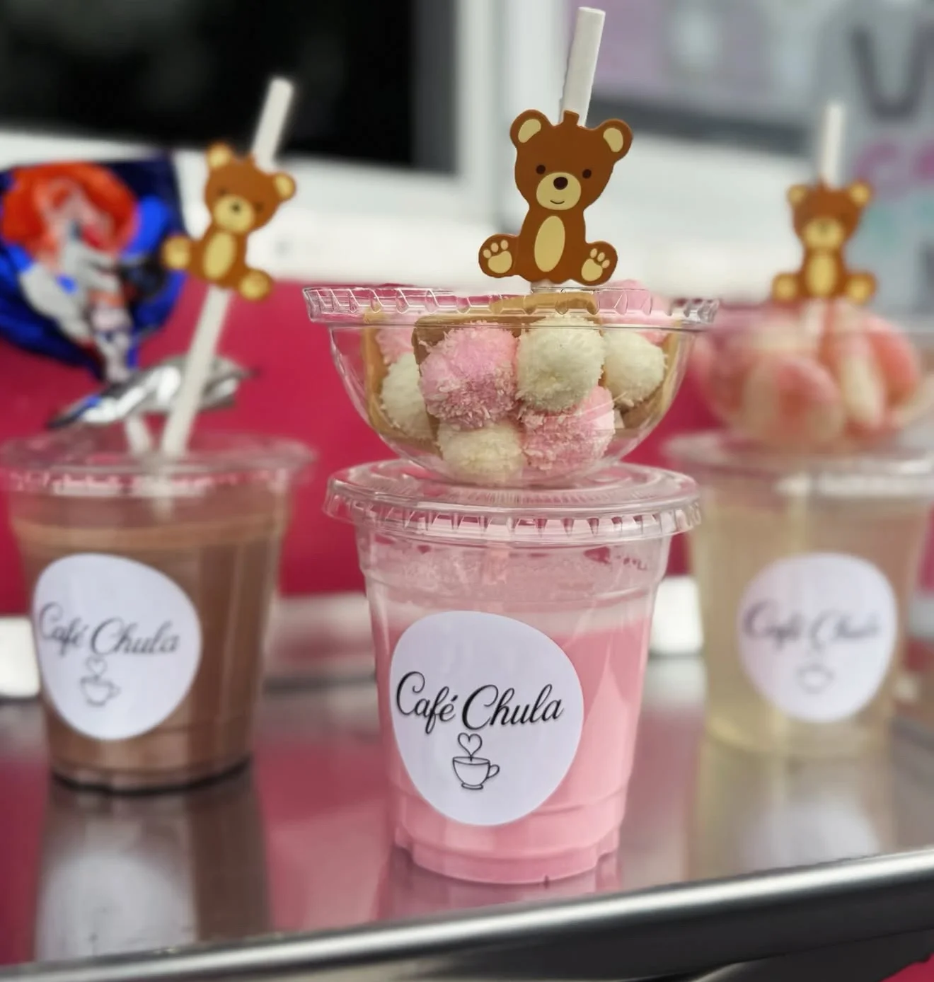 Colorful dessert drinks with bear toppers from Café Chula
