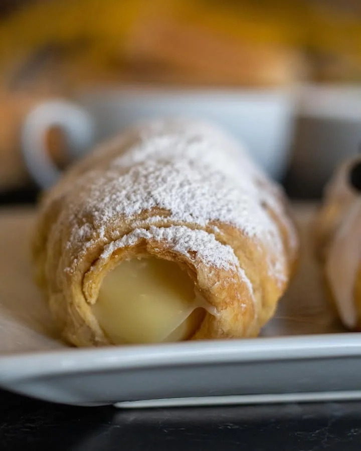 Delicious Italian cannoli dusted with powdered sugar