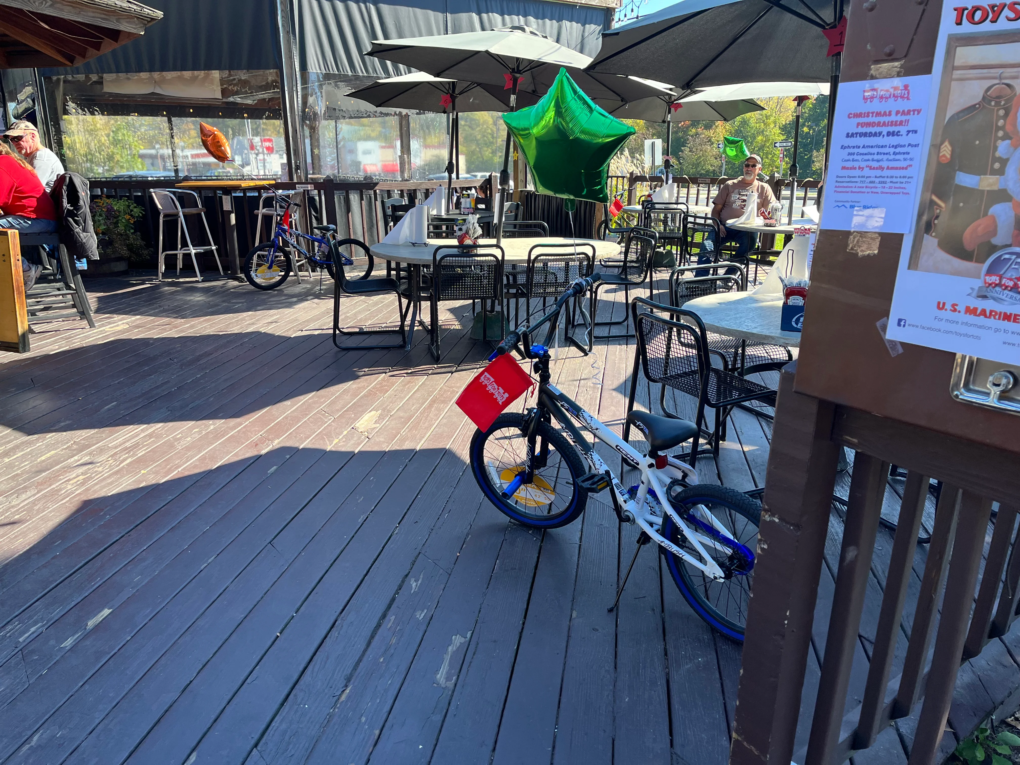 Outdoor dining area with tables and bicycles