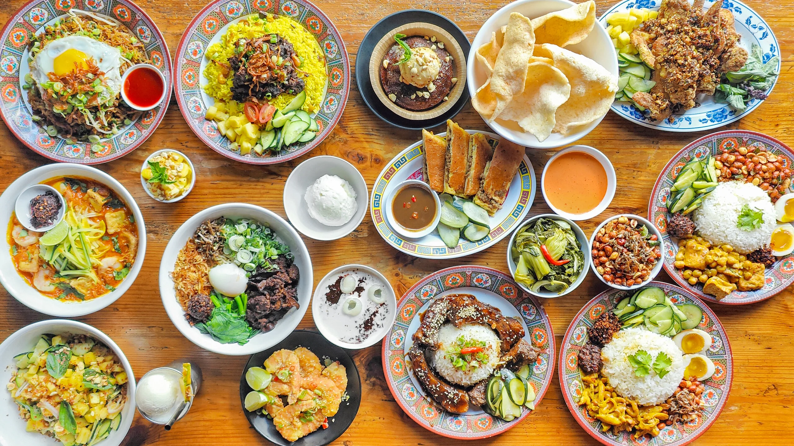 Assorted Malaysian dishes including nasi lemak and satay