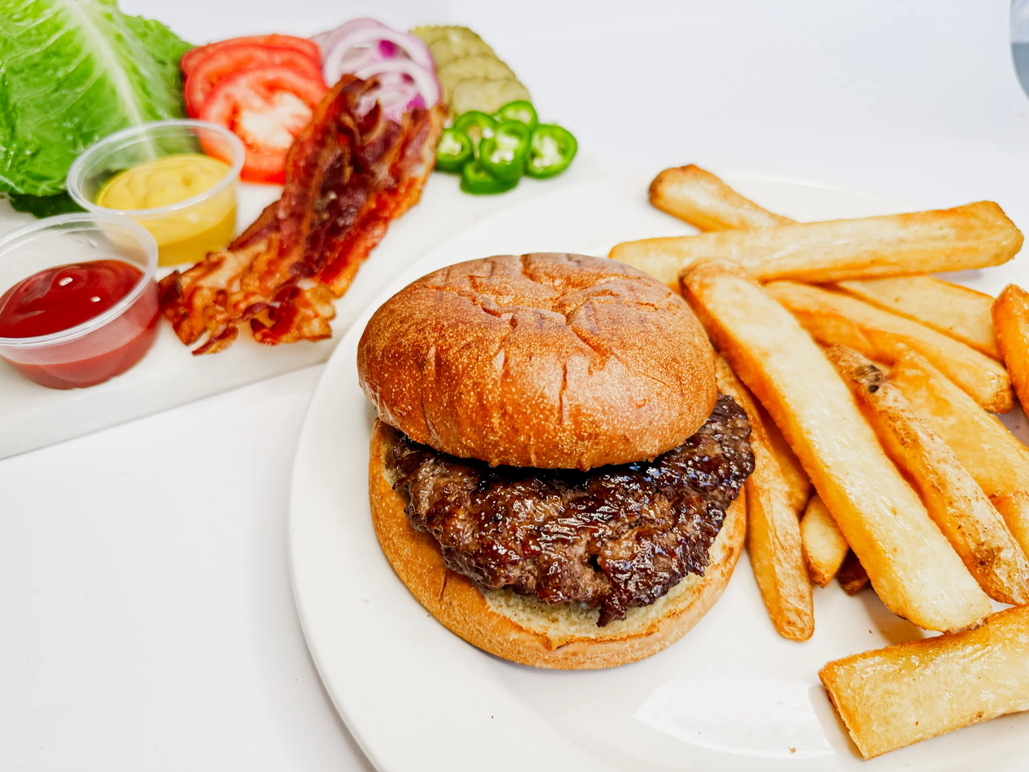 Classic American cheeseburger with fries and fresh toppings
