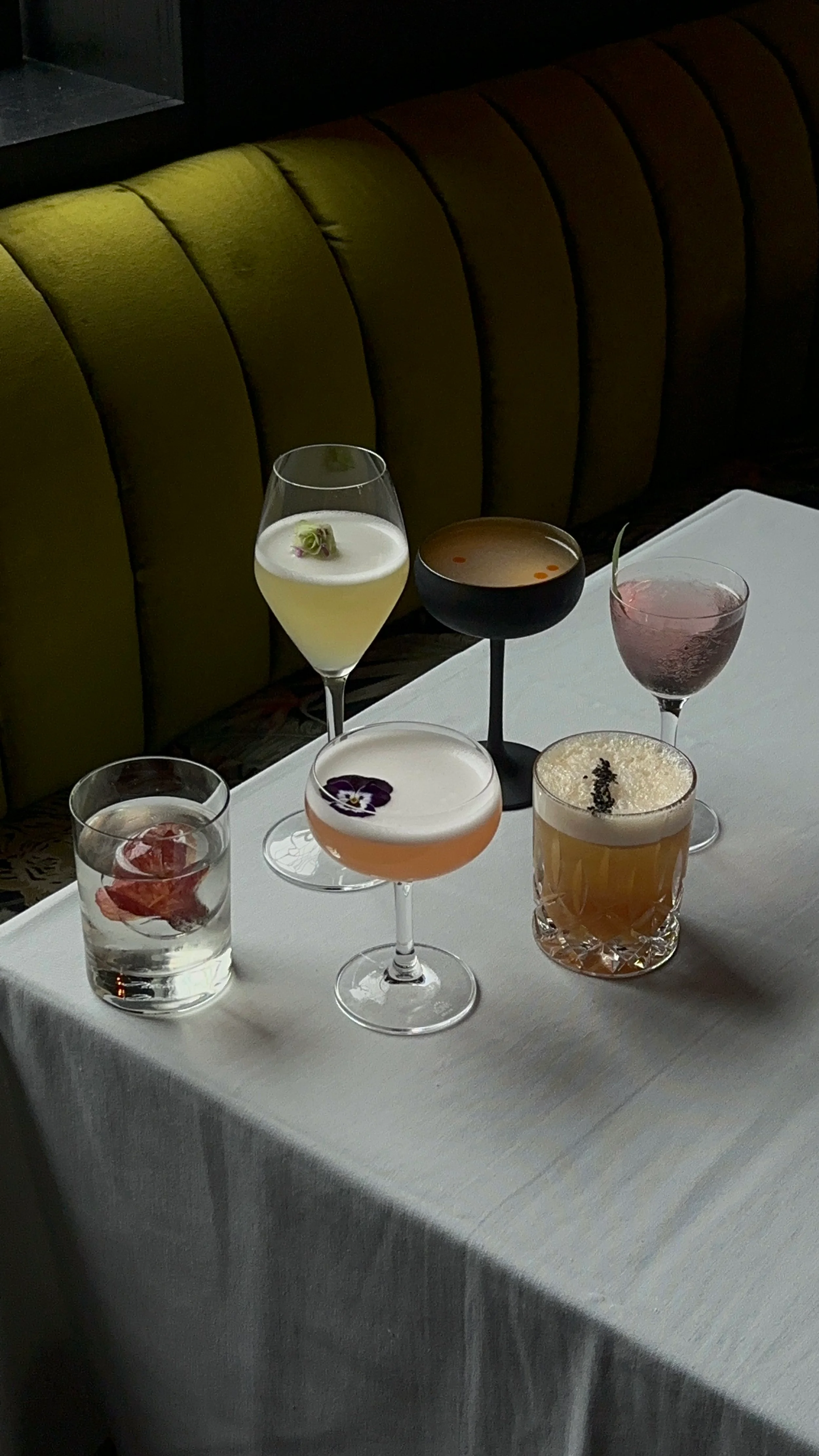 Artfully crafted cocktails on a table in a stylish bar setting