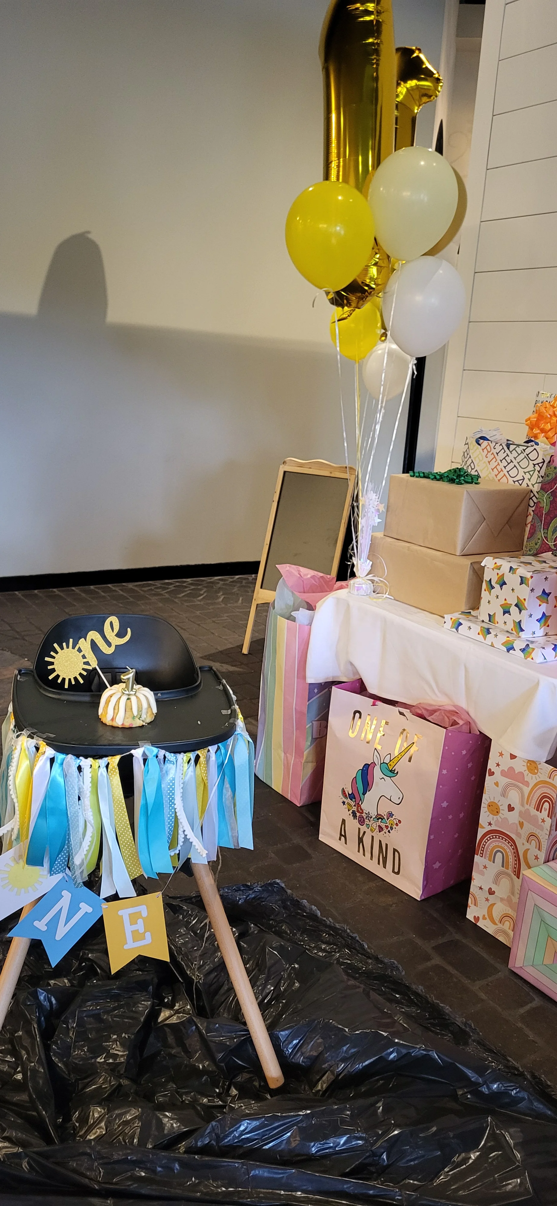 Colorful birthday party setup with decorations and gifts