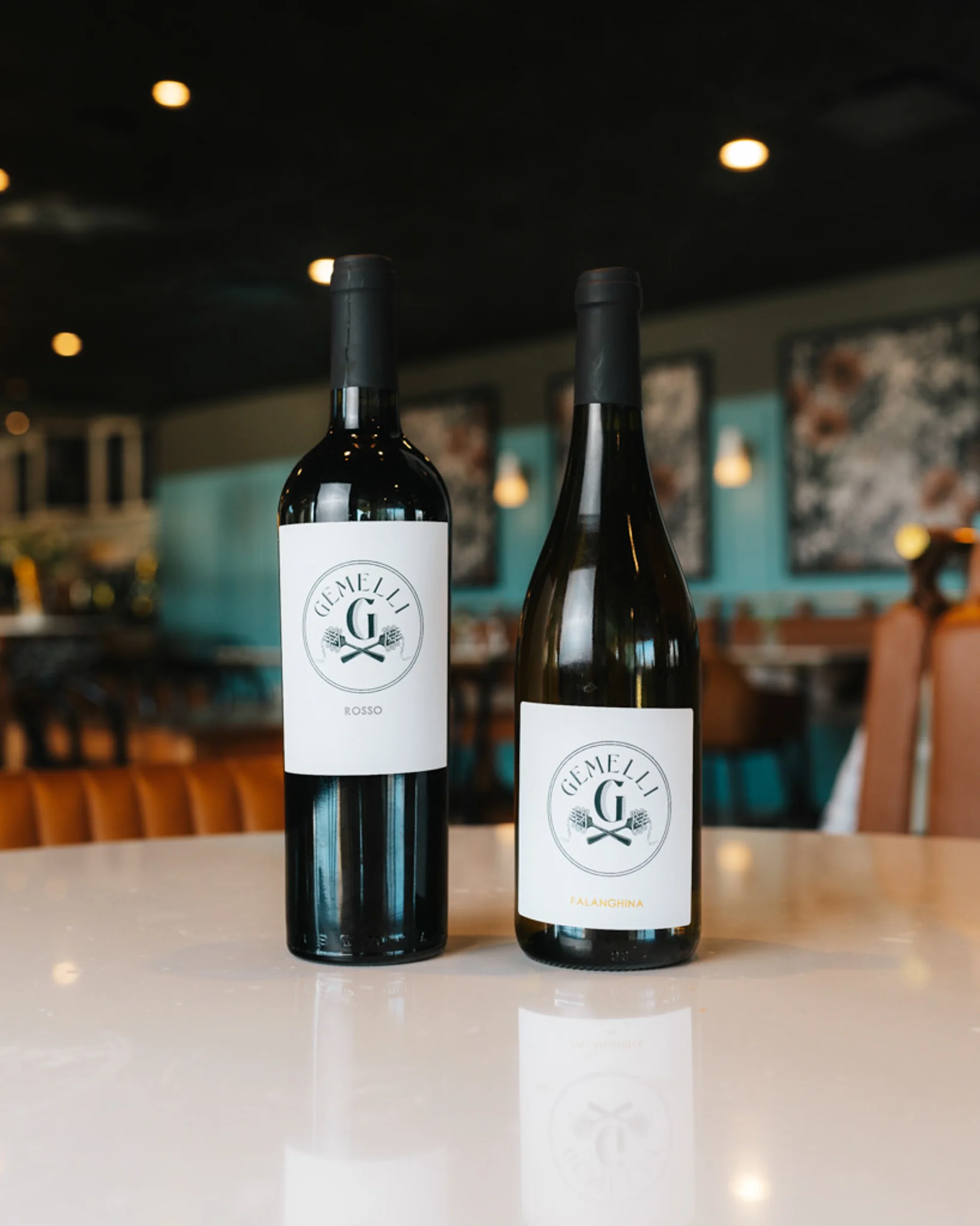 Two bottles of Italian wine on a restaurant table