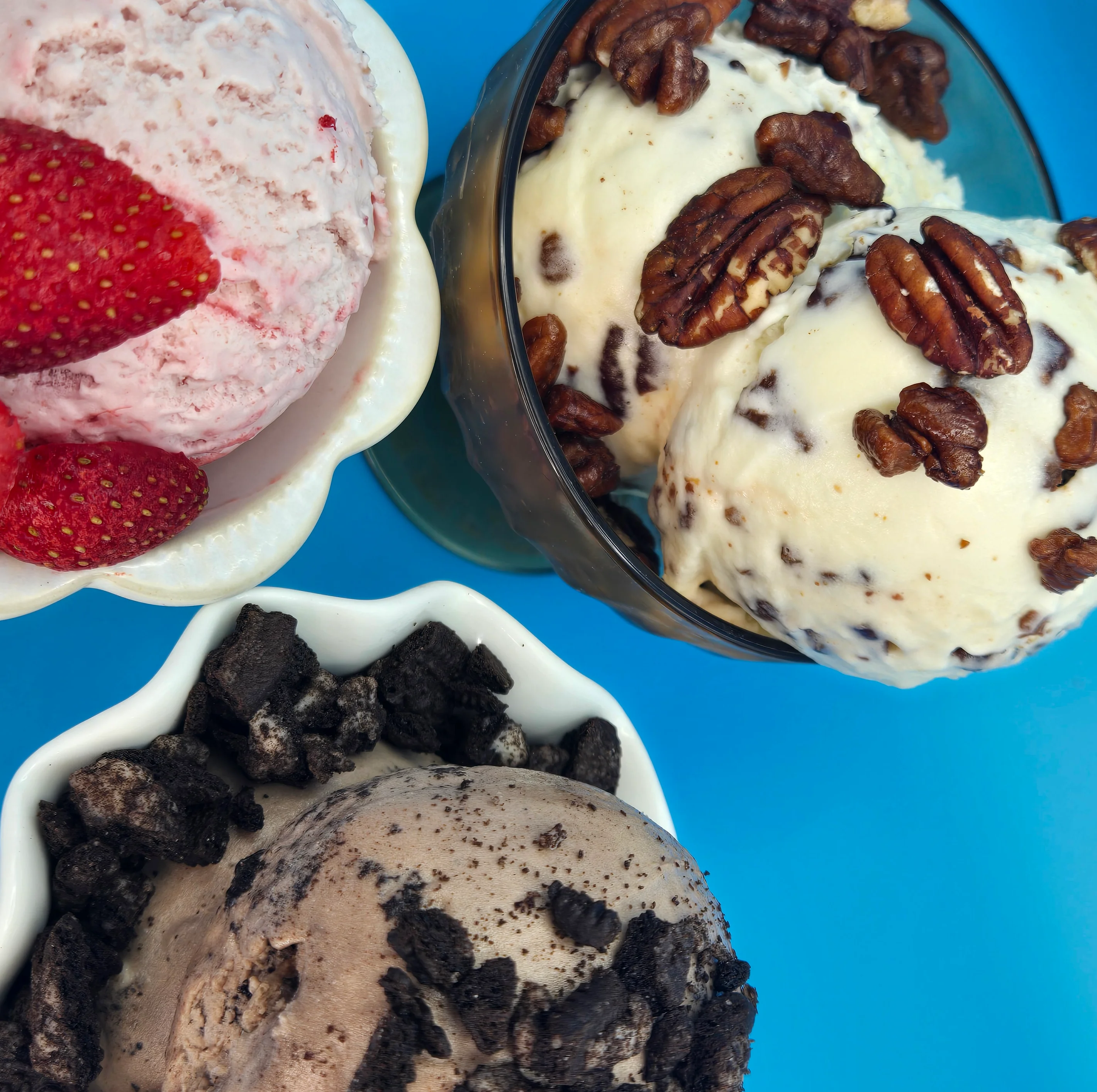 Assorted ice cream scoops in colorful bowls