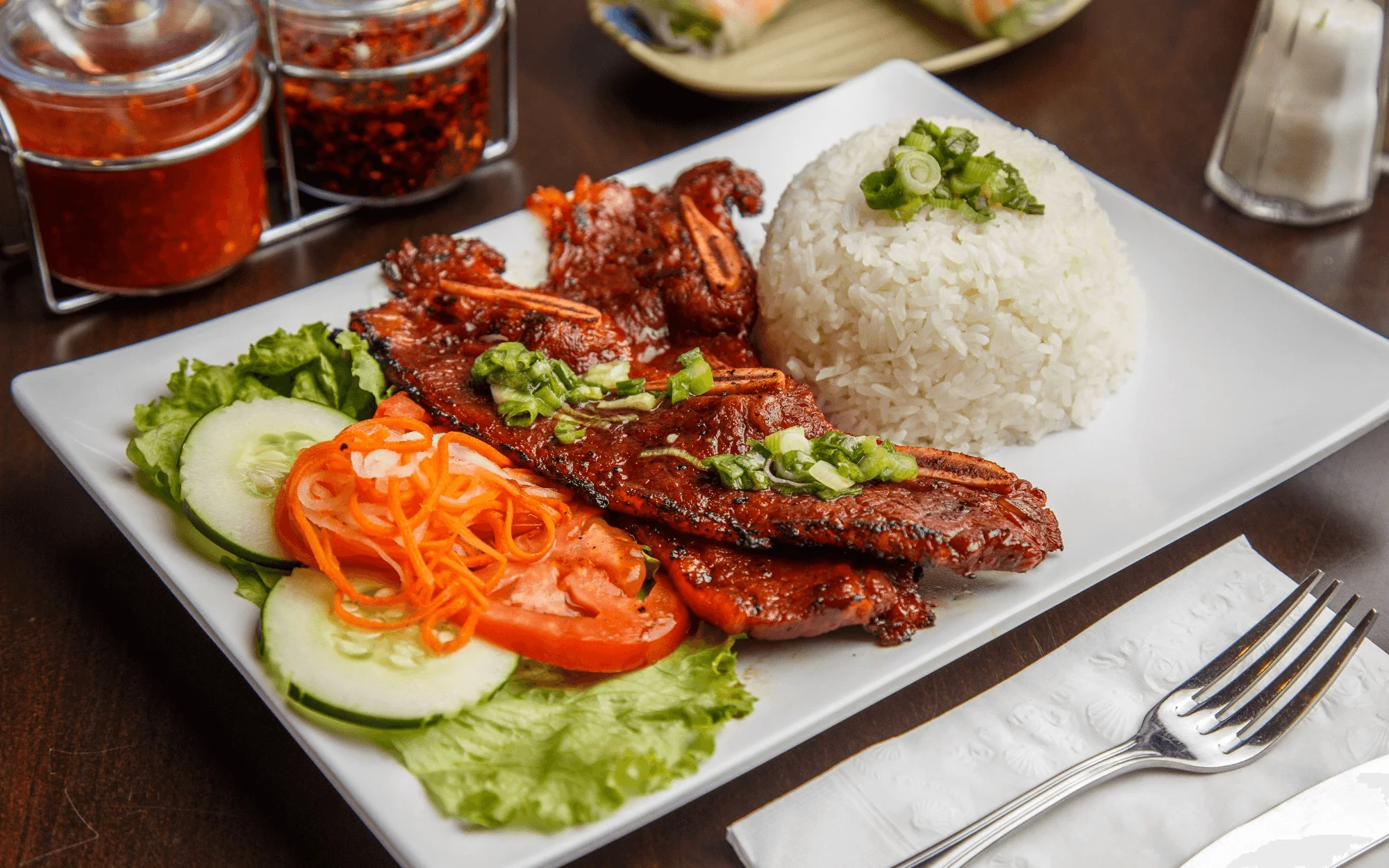 Vietnamese grilled pork with rice and fresh vegetables