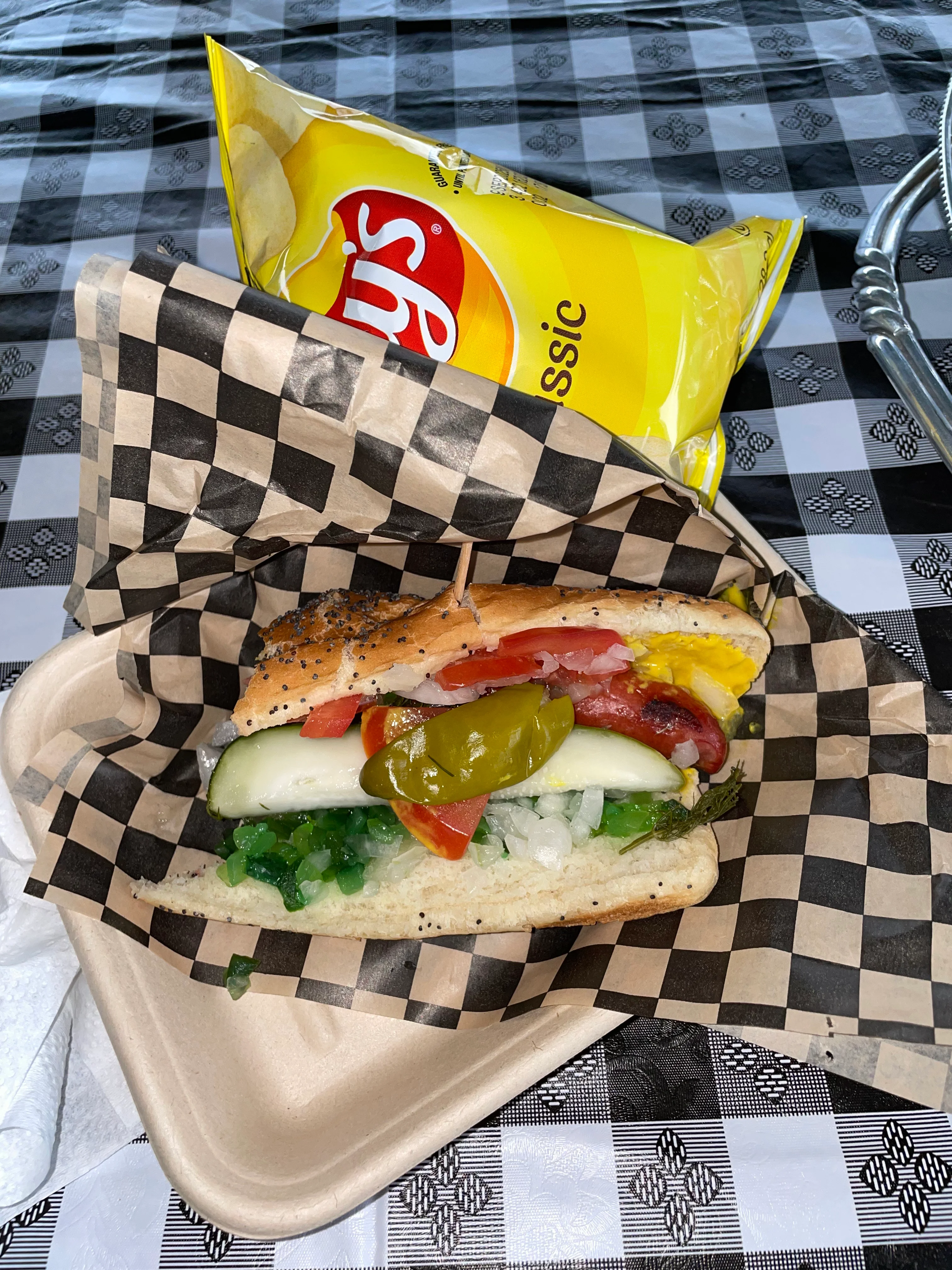 Chicago-style hot dog with toppings in a paper tray