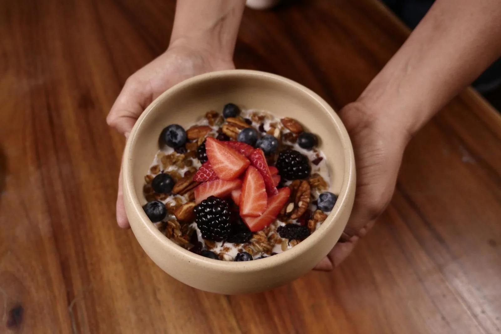 Healthy breakfast bowl with granola and fresh berries