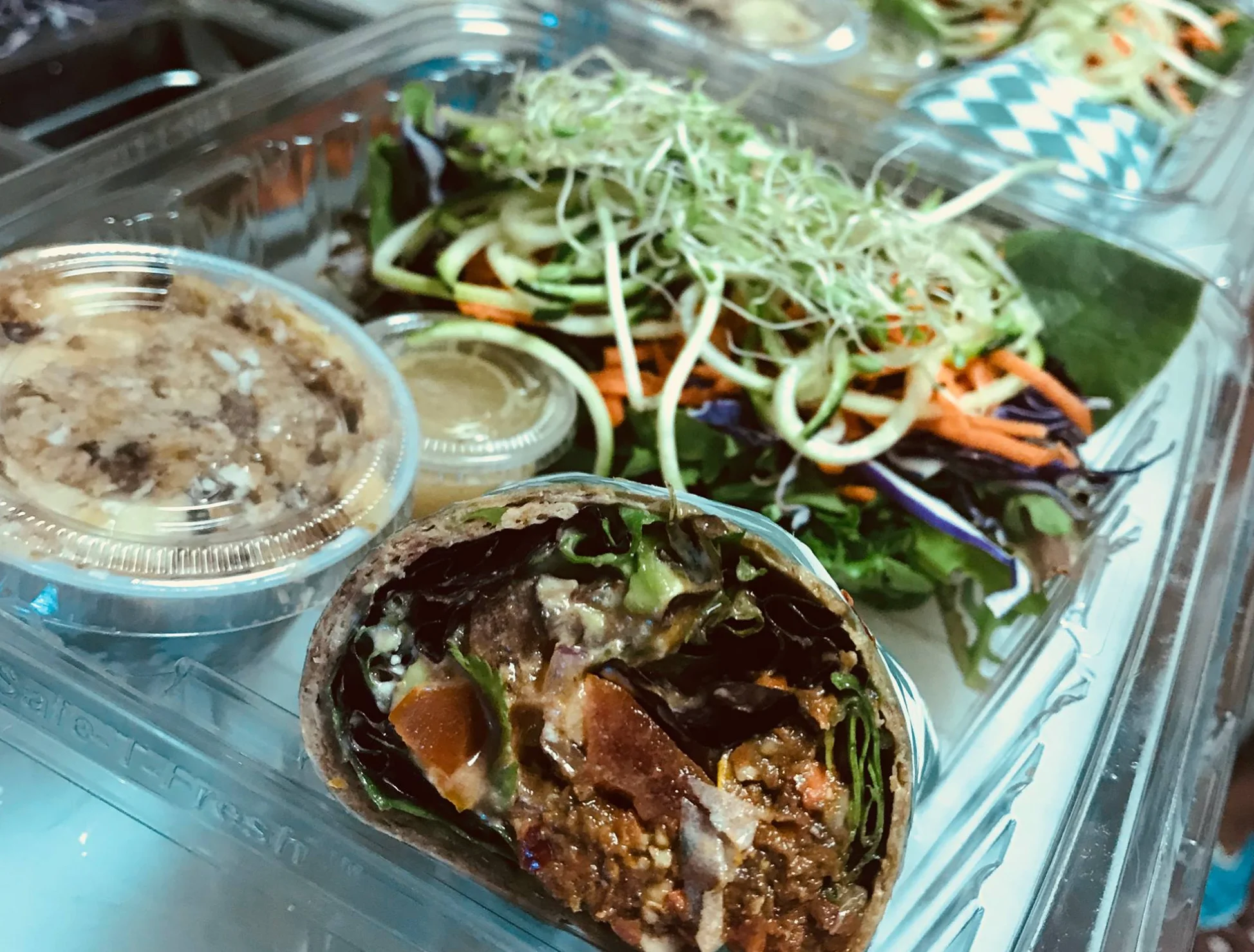 Vegan wrap with fresh greens and side salad
