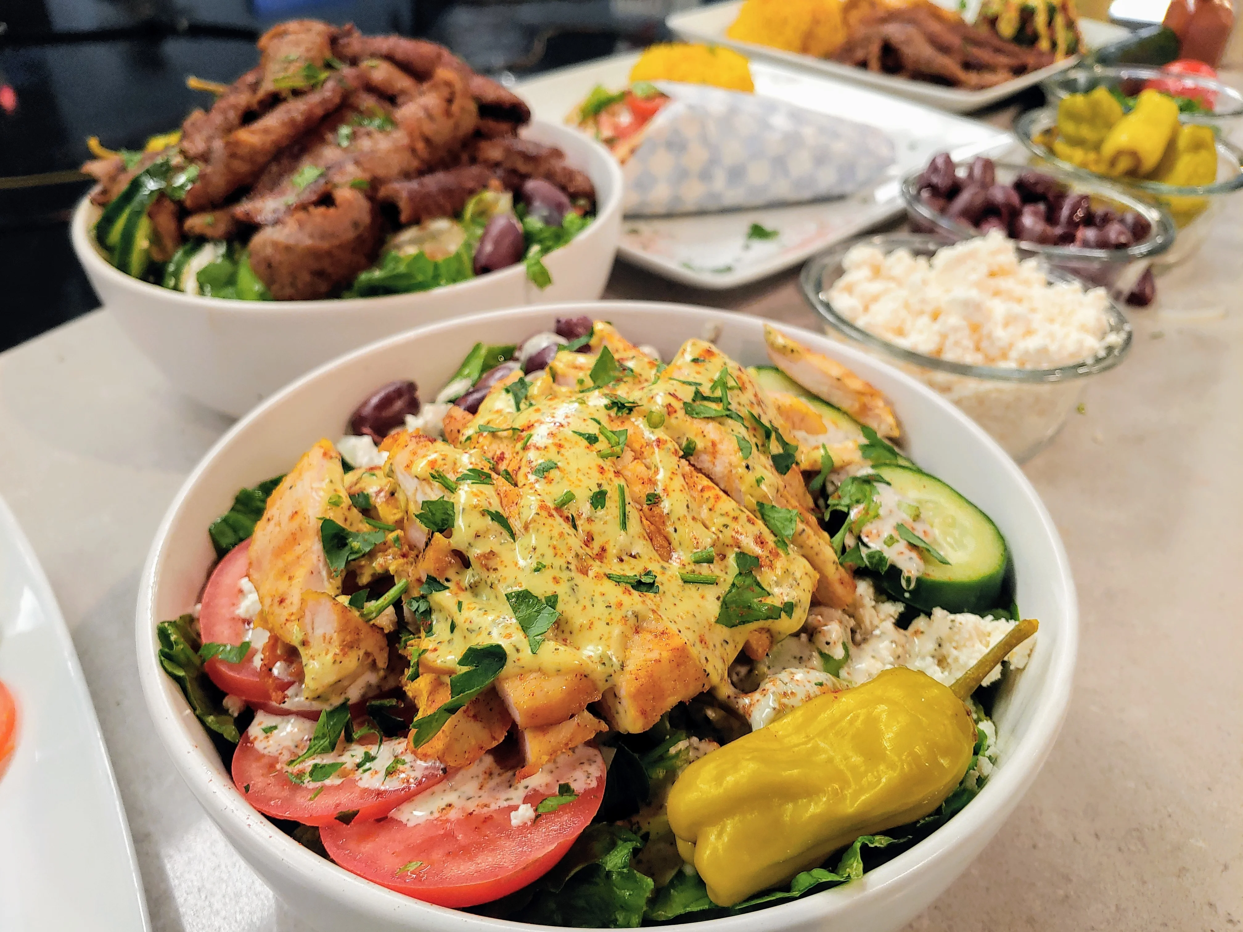 Assorted Mediterranean dishes with grilled meats and fresh sides