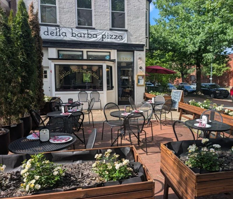 Charming outdoor dining area of a pizza restaurant