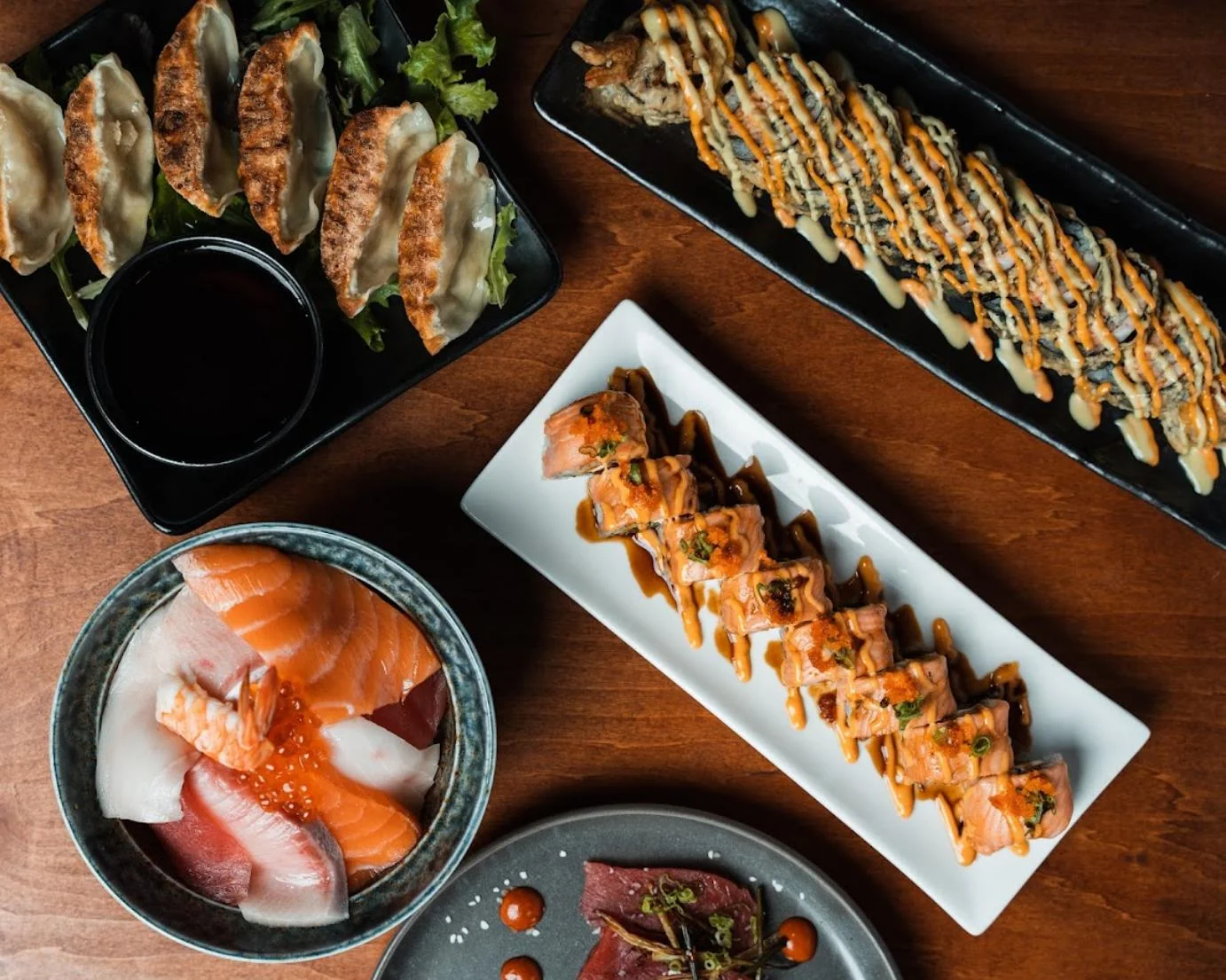 Assorted Japanese sushi platter with sashimi and gyoza