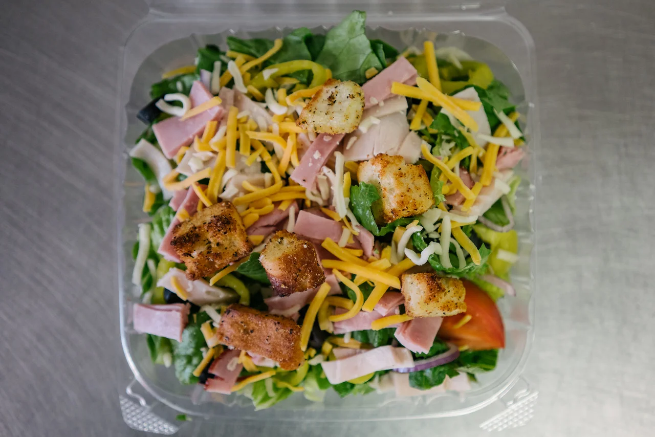 Fresh garden salad with ham and cheese