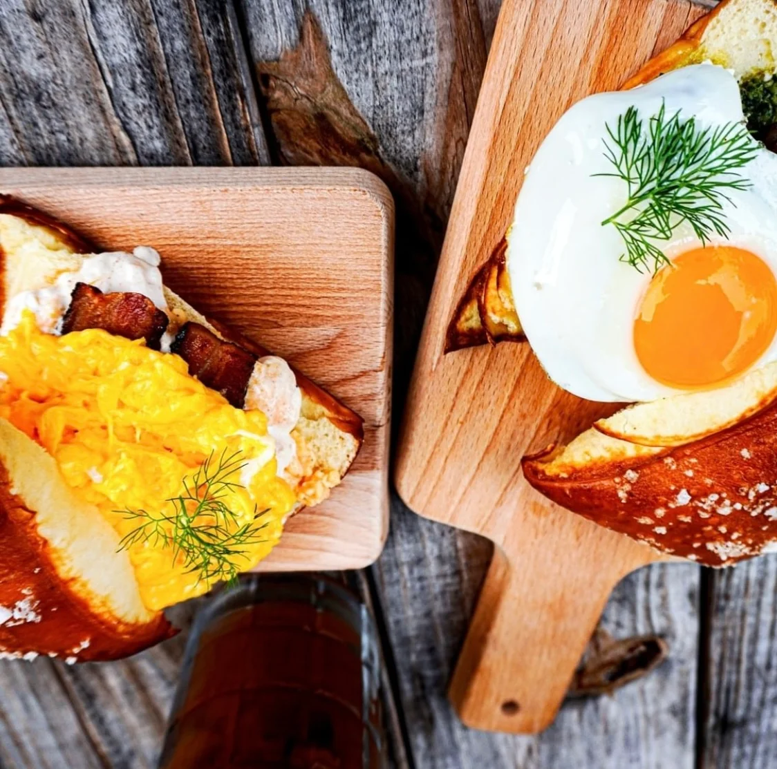 Breakfast sandwiches with eggs on pretzel buns