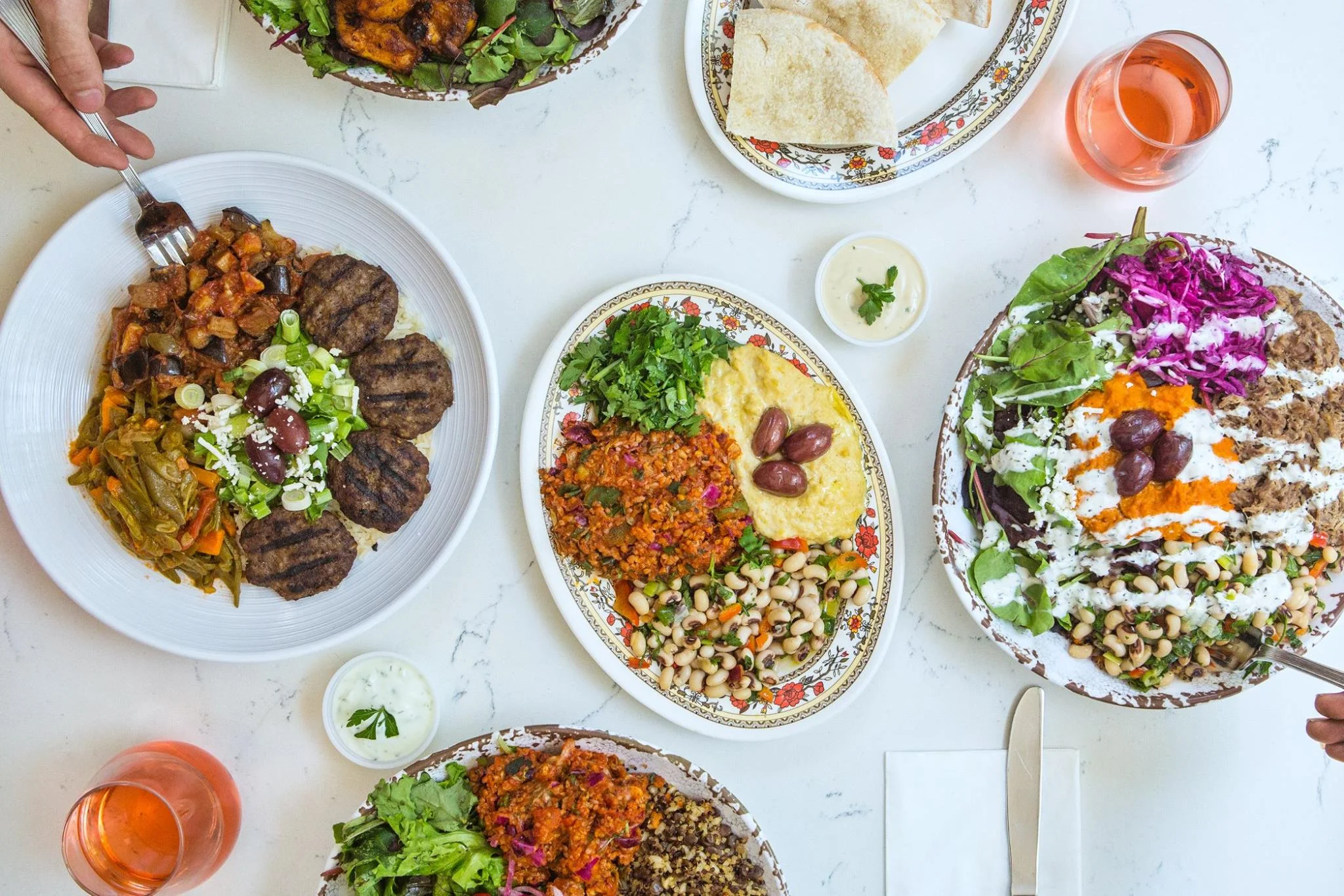 Mediterranean mixed platter with grilled meats and fresh salads