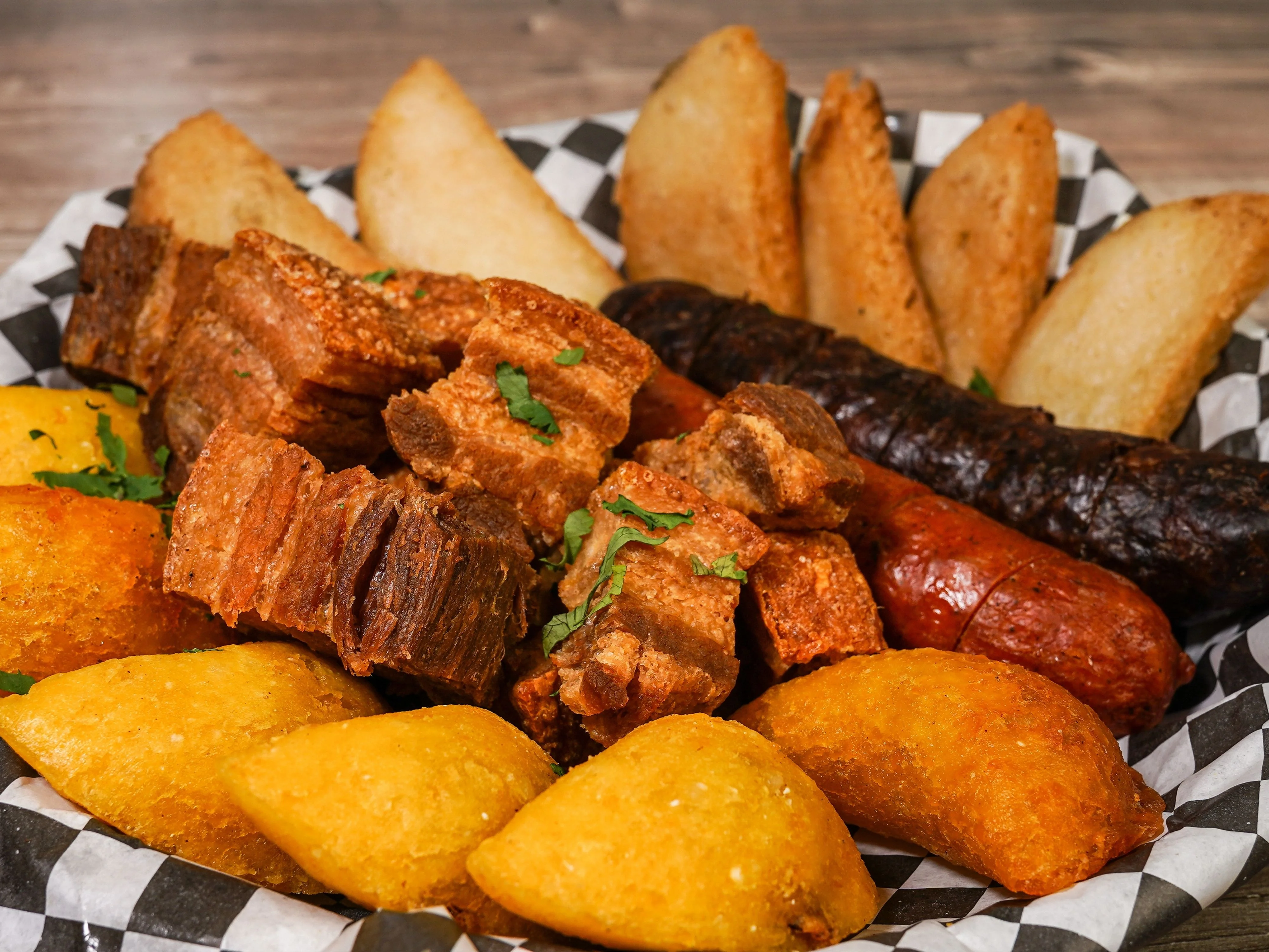Platter of Colombian bandeja paisa with assorted meats and sides