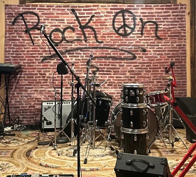 Live music stage with instruments and rustic decor