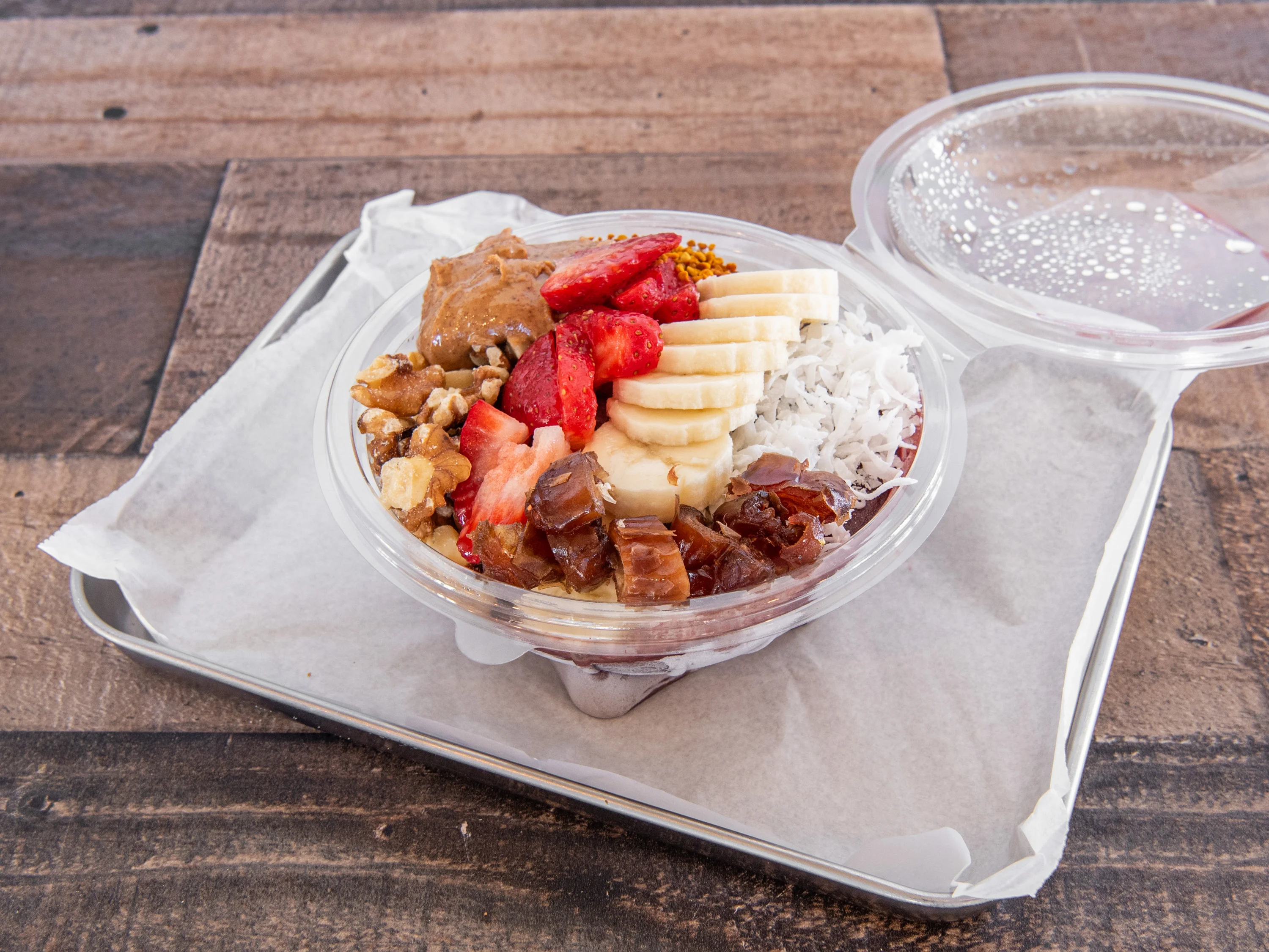 Colorful acai bowl topped with fruits and nuts