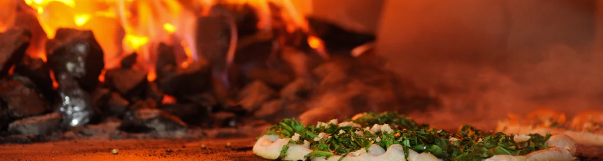 Freshly baked naan bread in a tandoor oven