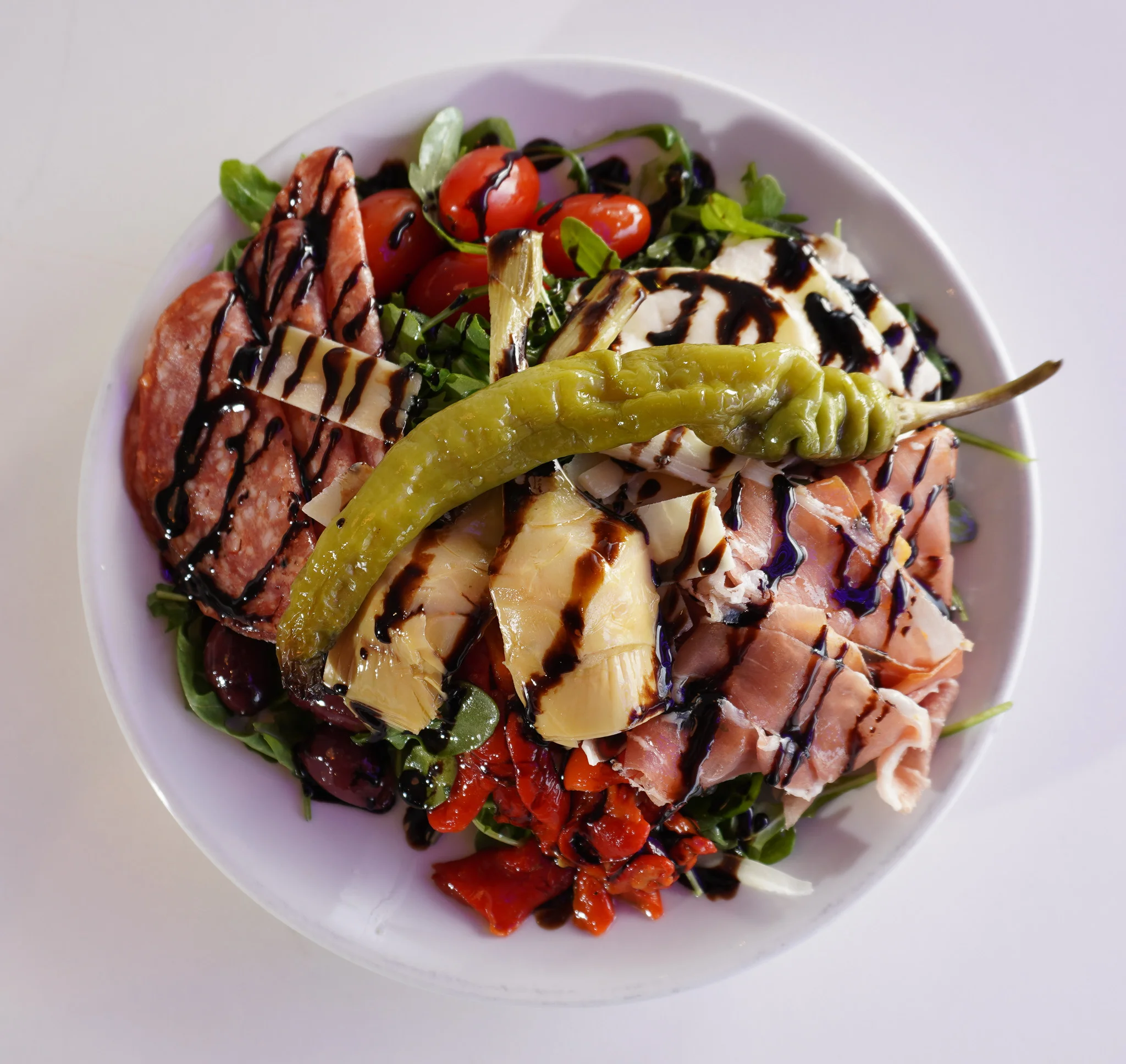 Italian antipasto salad with cured meats and greens