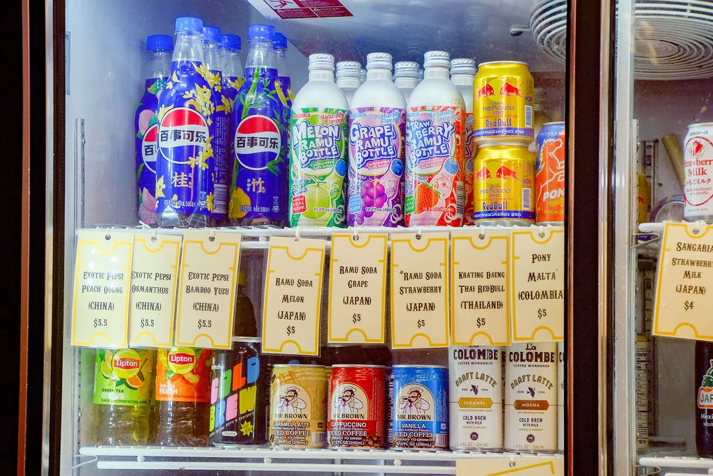 Variety of international soft drinks in a vending fridge