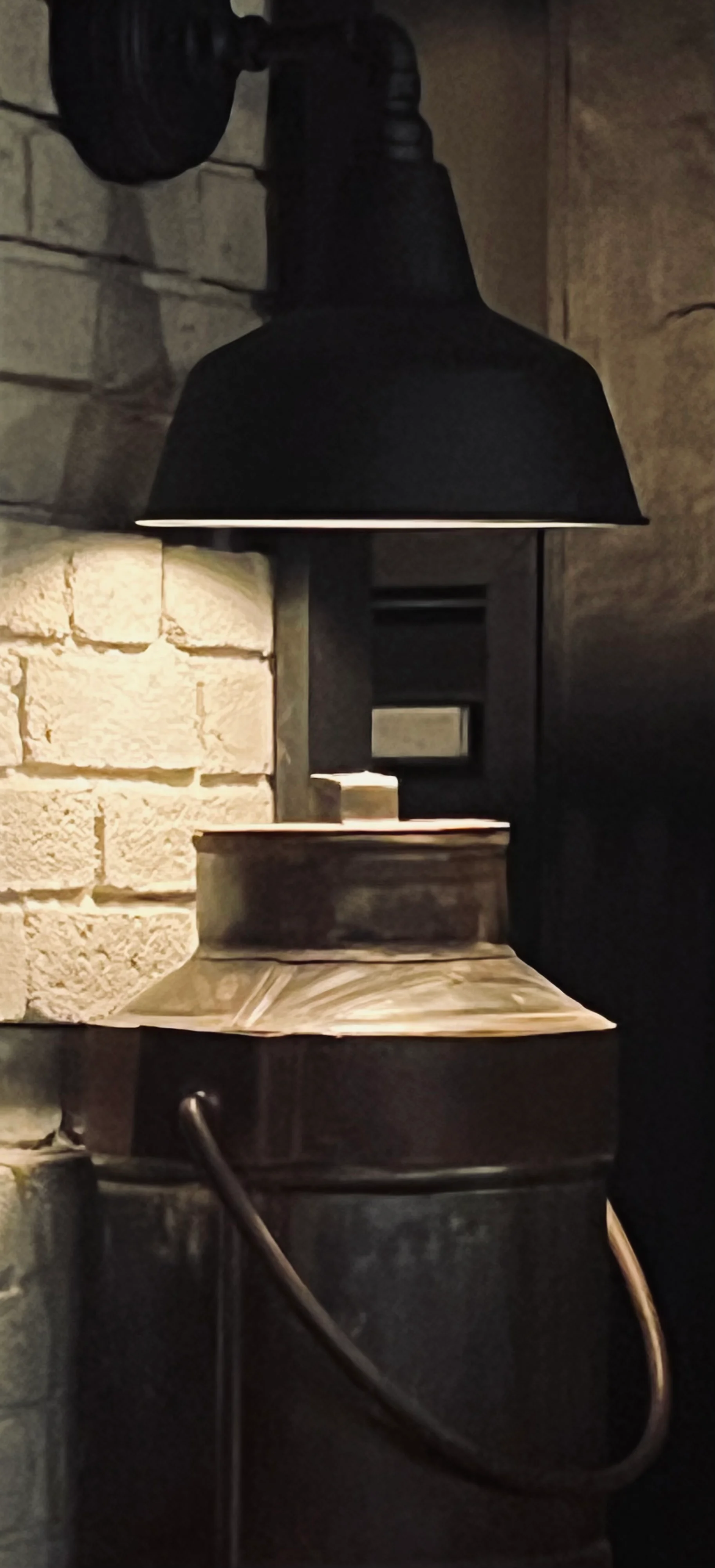 Vintage milk can with industrial lamp in cozy restaurant setting