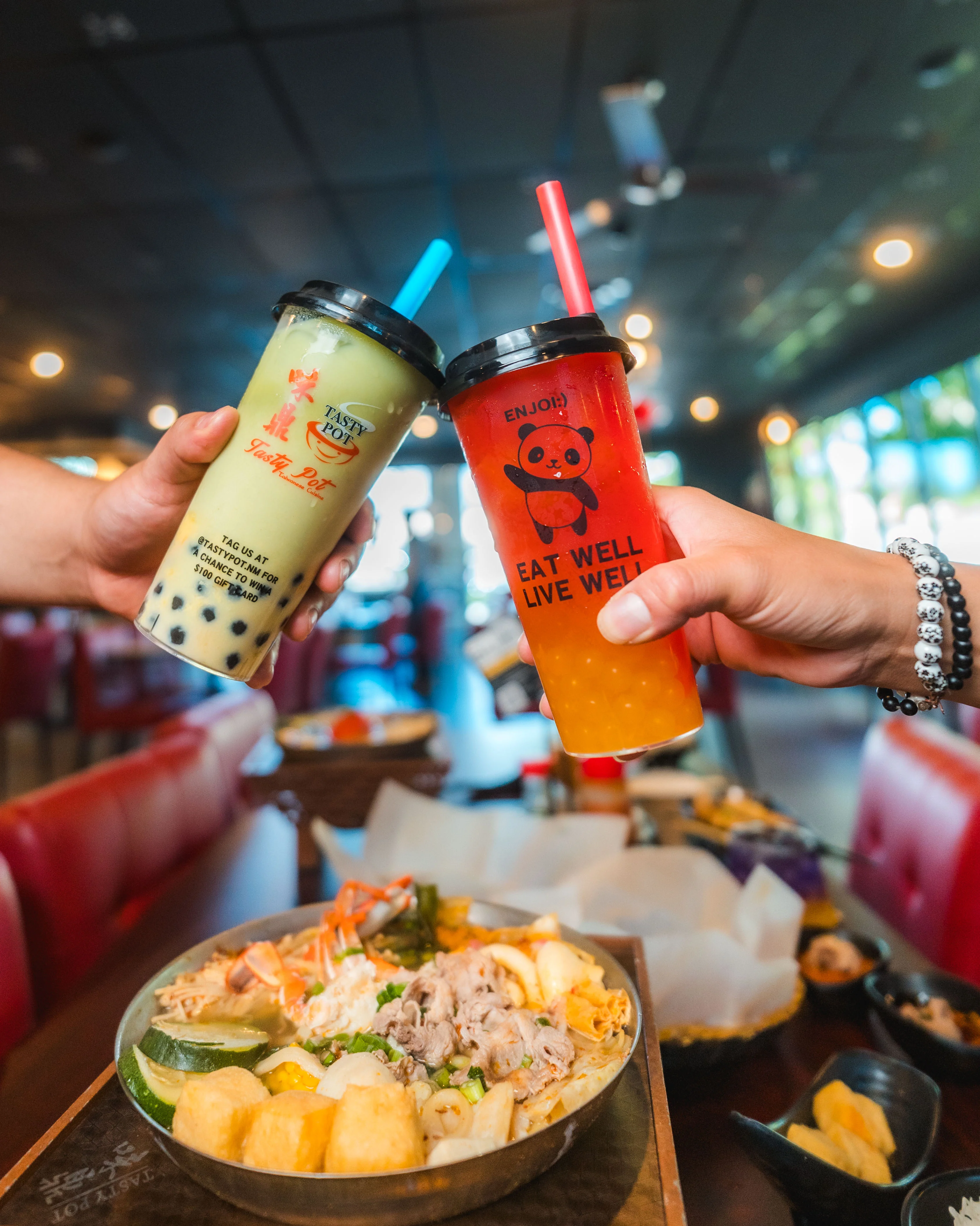Colorful bubble tea and hot pot in a vibrant restaurant setting