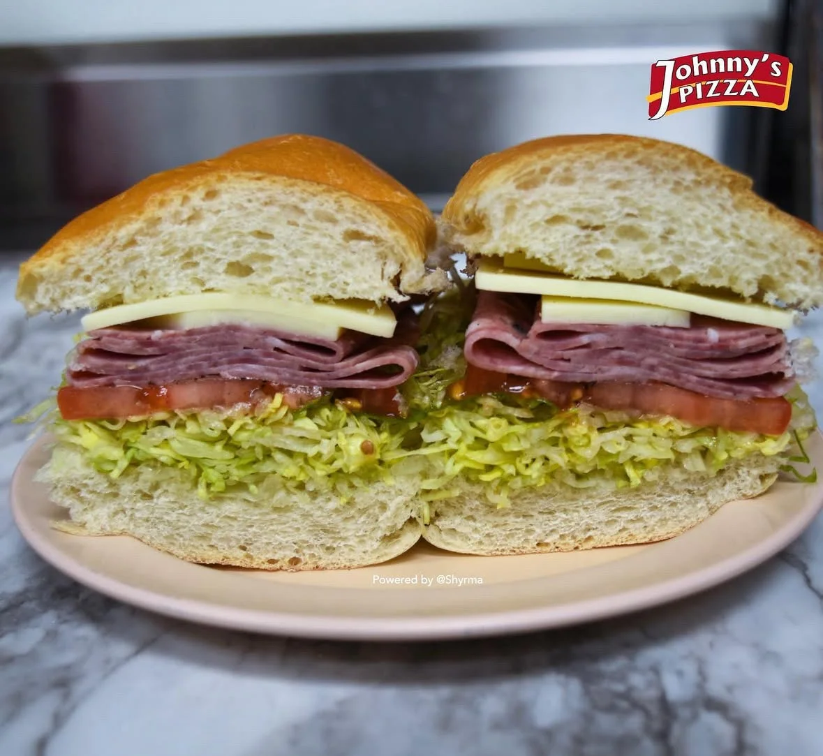 Italian deli sandwich with meats and fresh vegetables