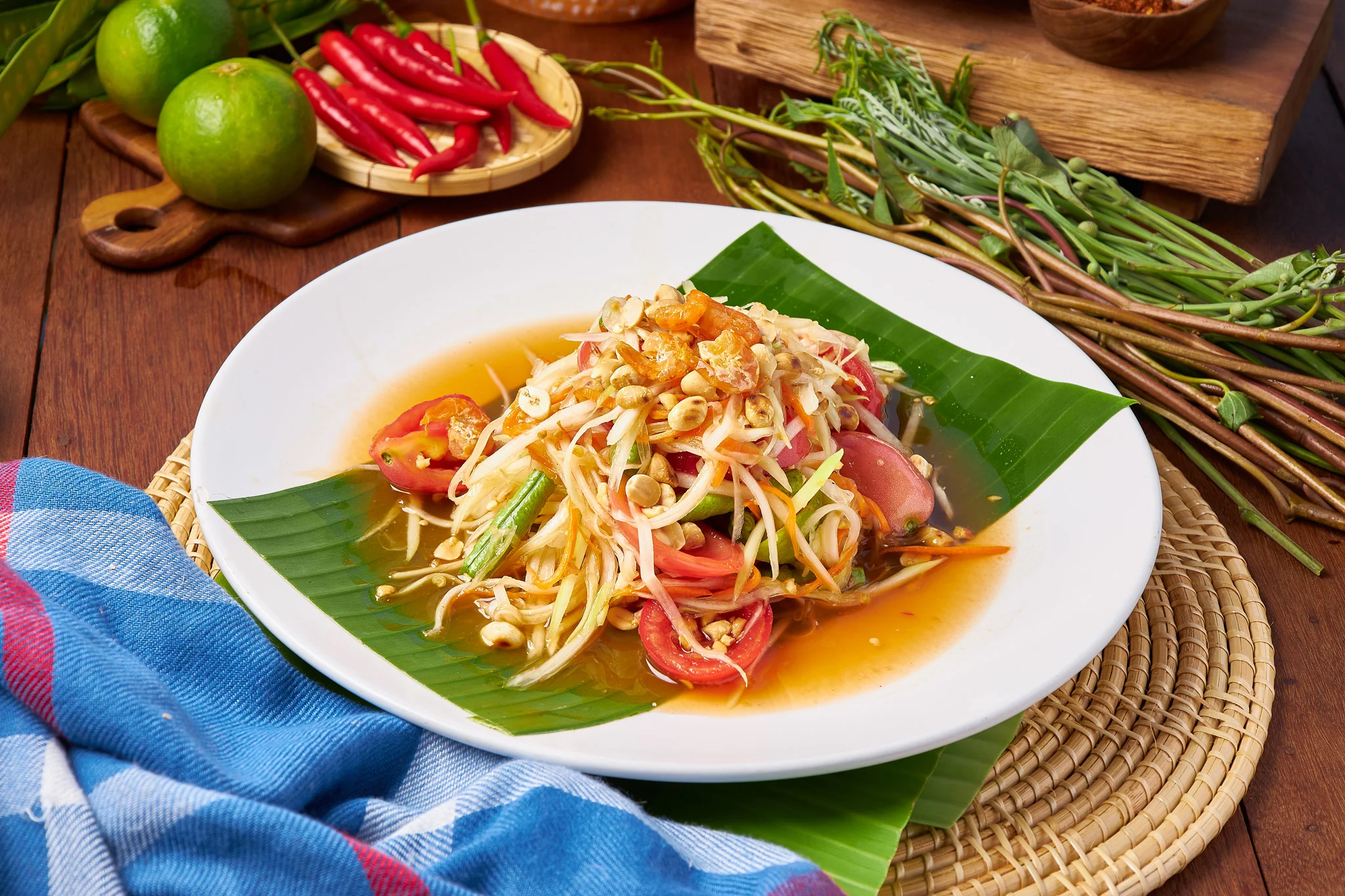 Thai papaya salad served on banana leaves