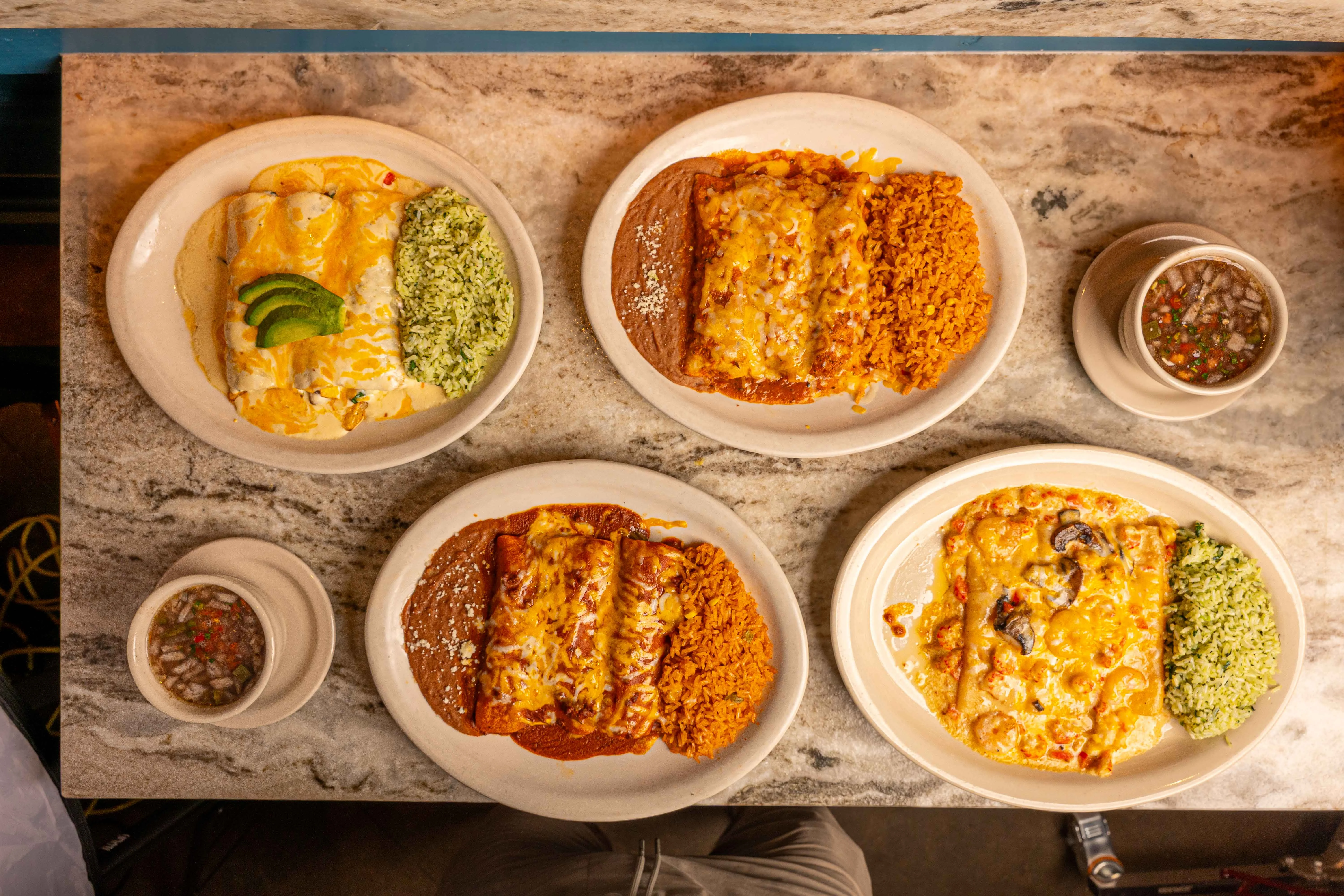 Delicious Mexican enchiladas with rice and beans