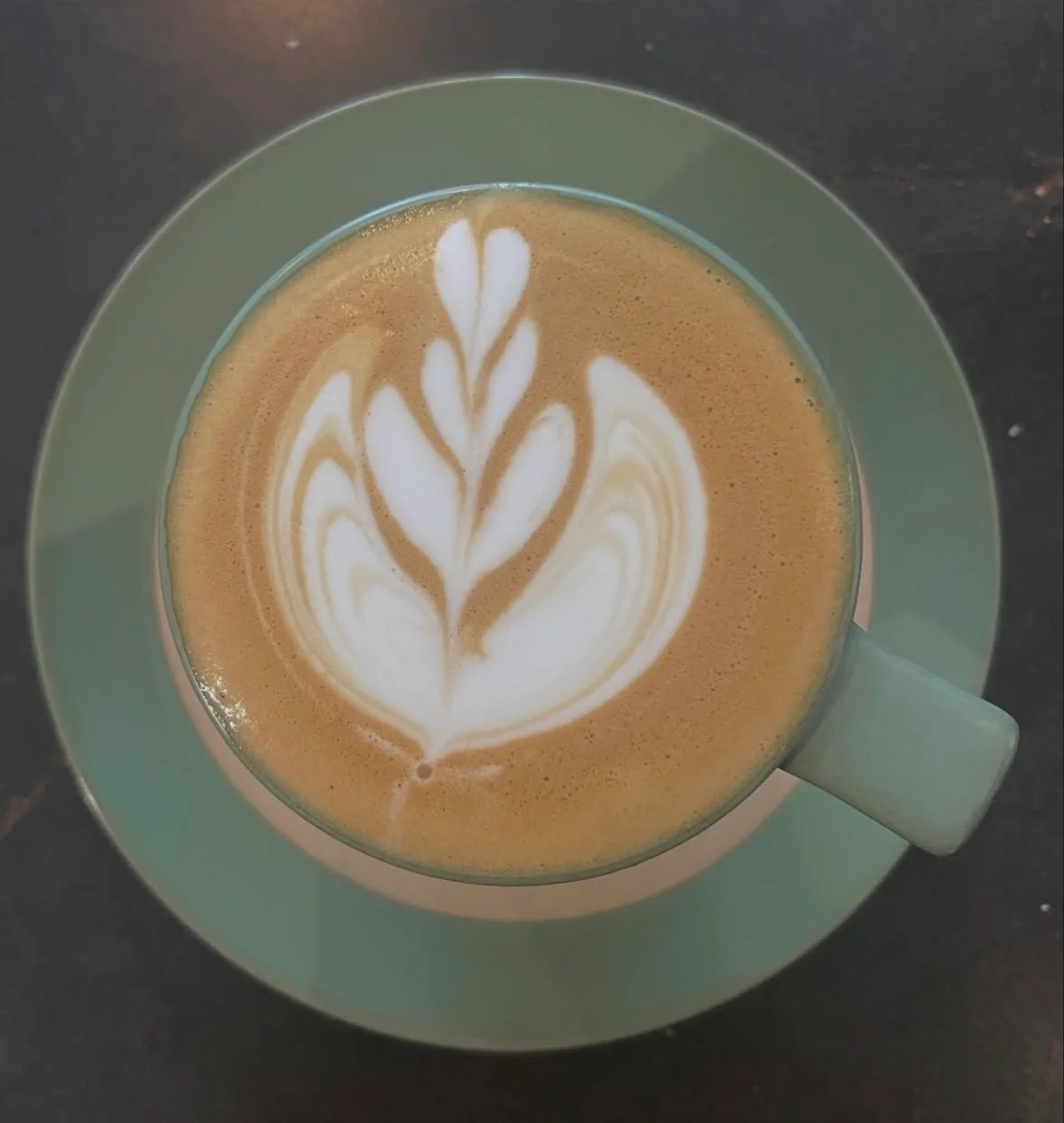Artisan latte with beautiful leaf design