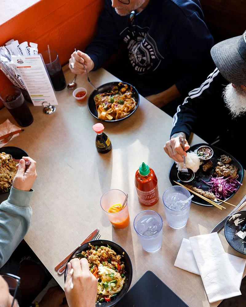 Colorful Asian stir-fry dishes served in a cozy restaurant setting