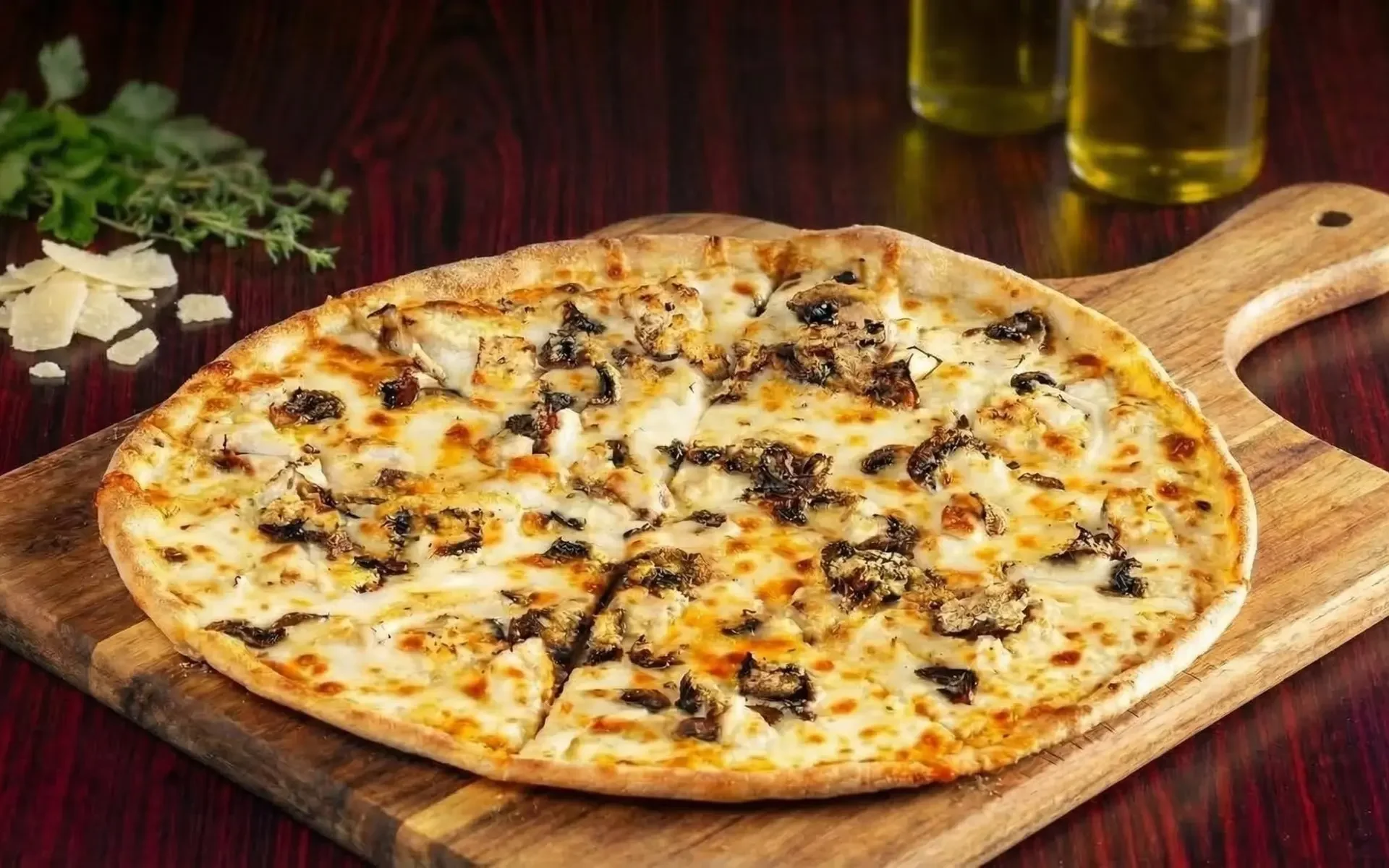 Gourmet white pizza with mushrooms and cheese