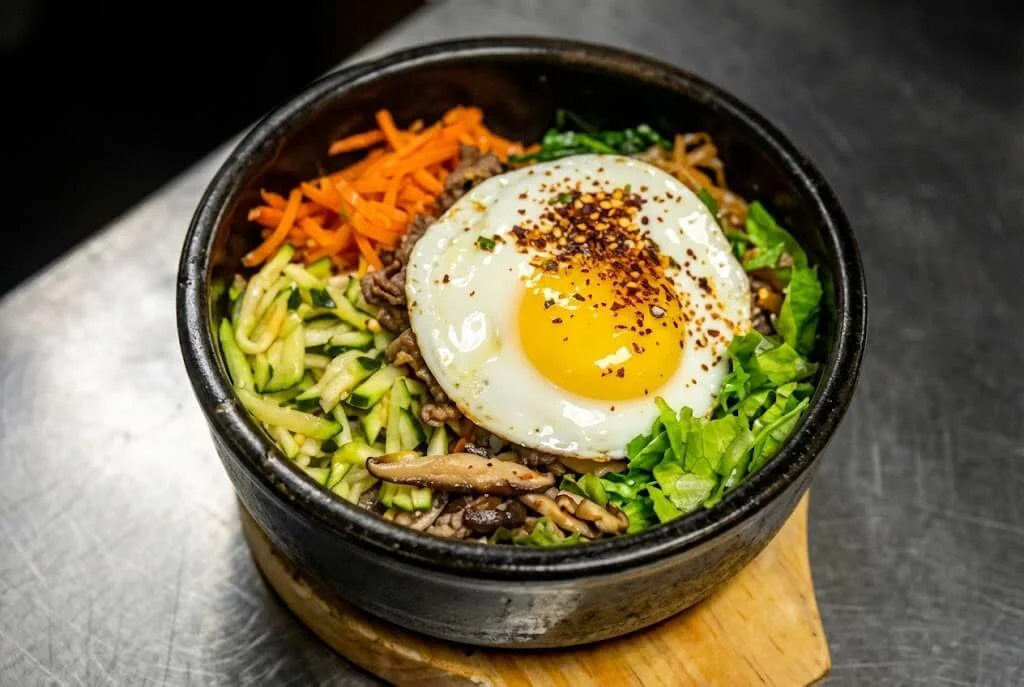 Korean bibimbap served in a hot stone bowl