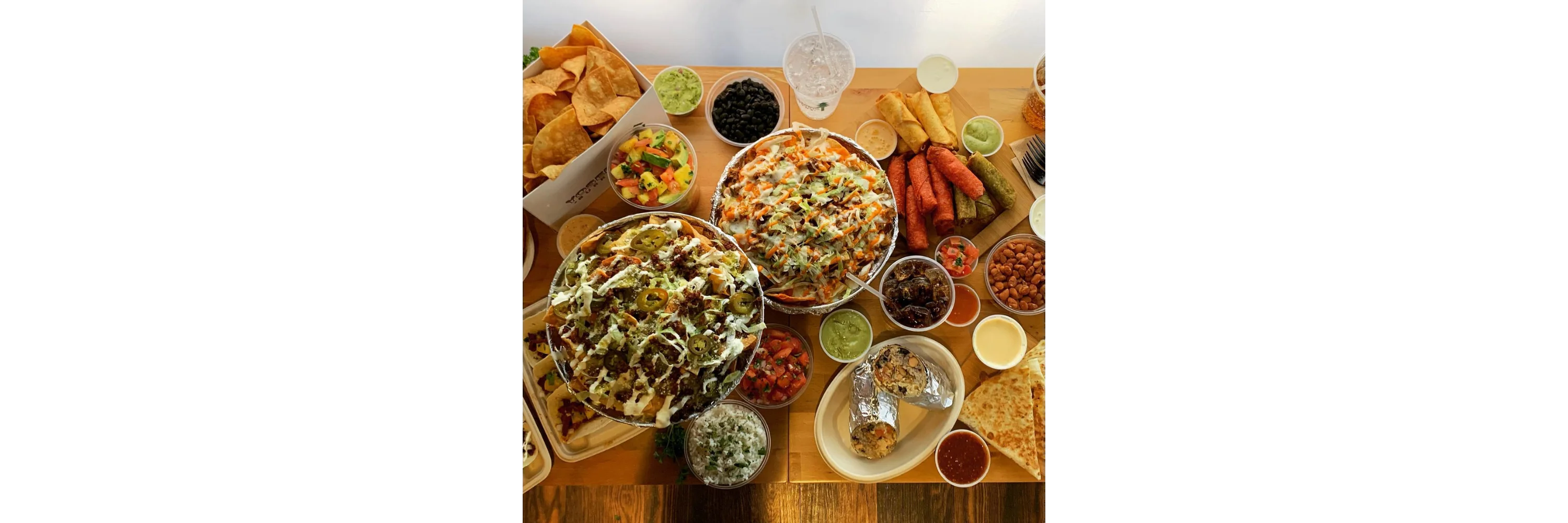 Vibrant Mexican feast with nachos, tacos, and fresh salsas