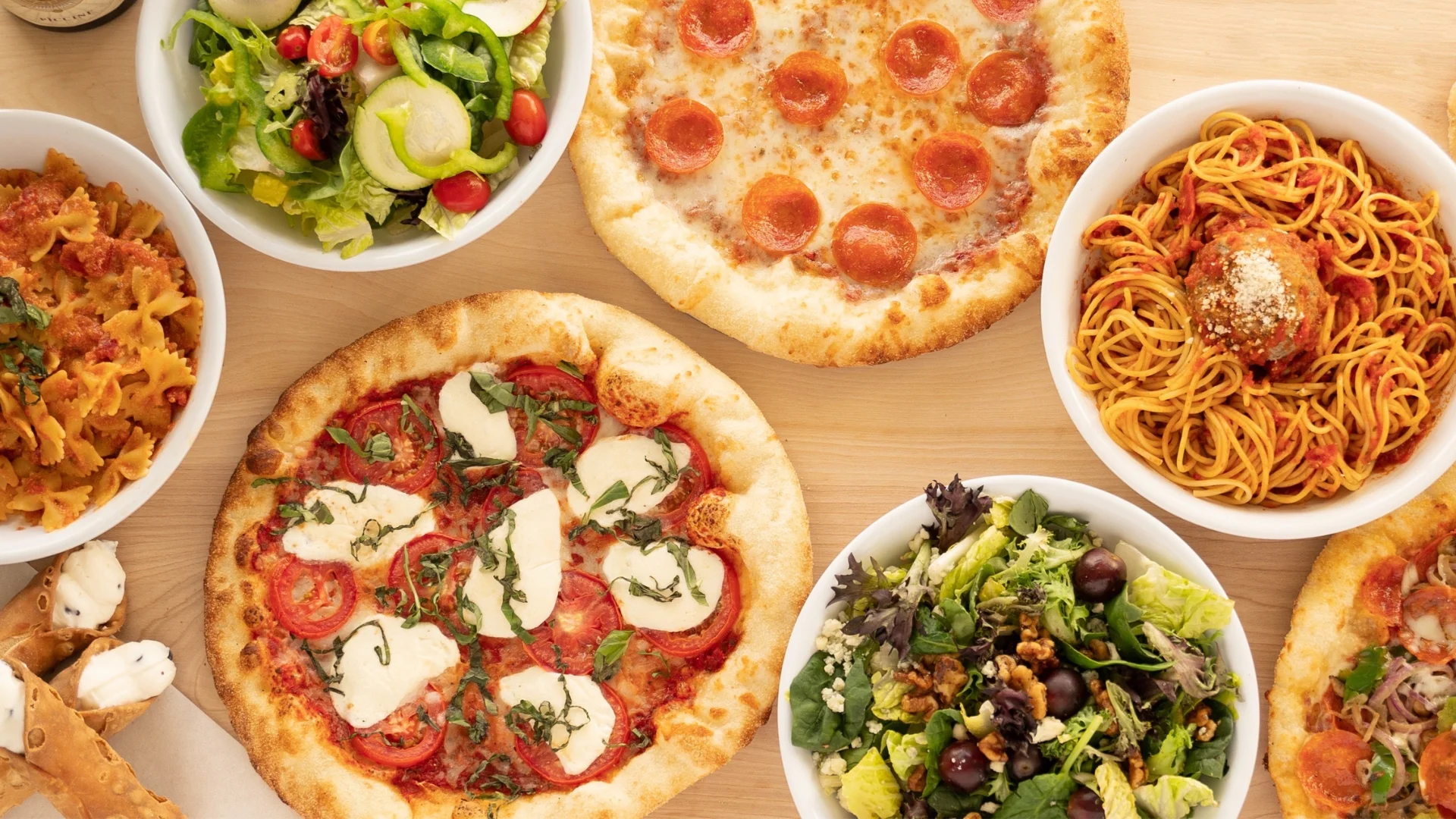 Italian feast featuring pepperoni pizza and spaghetti with meatballs