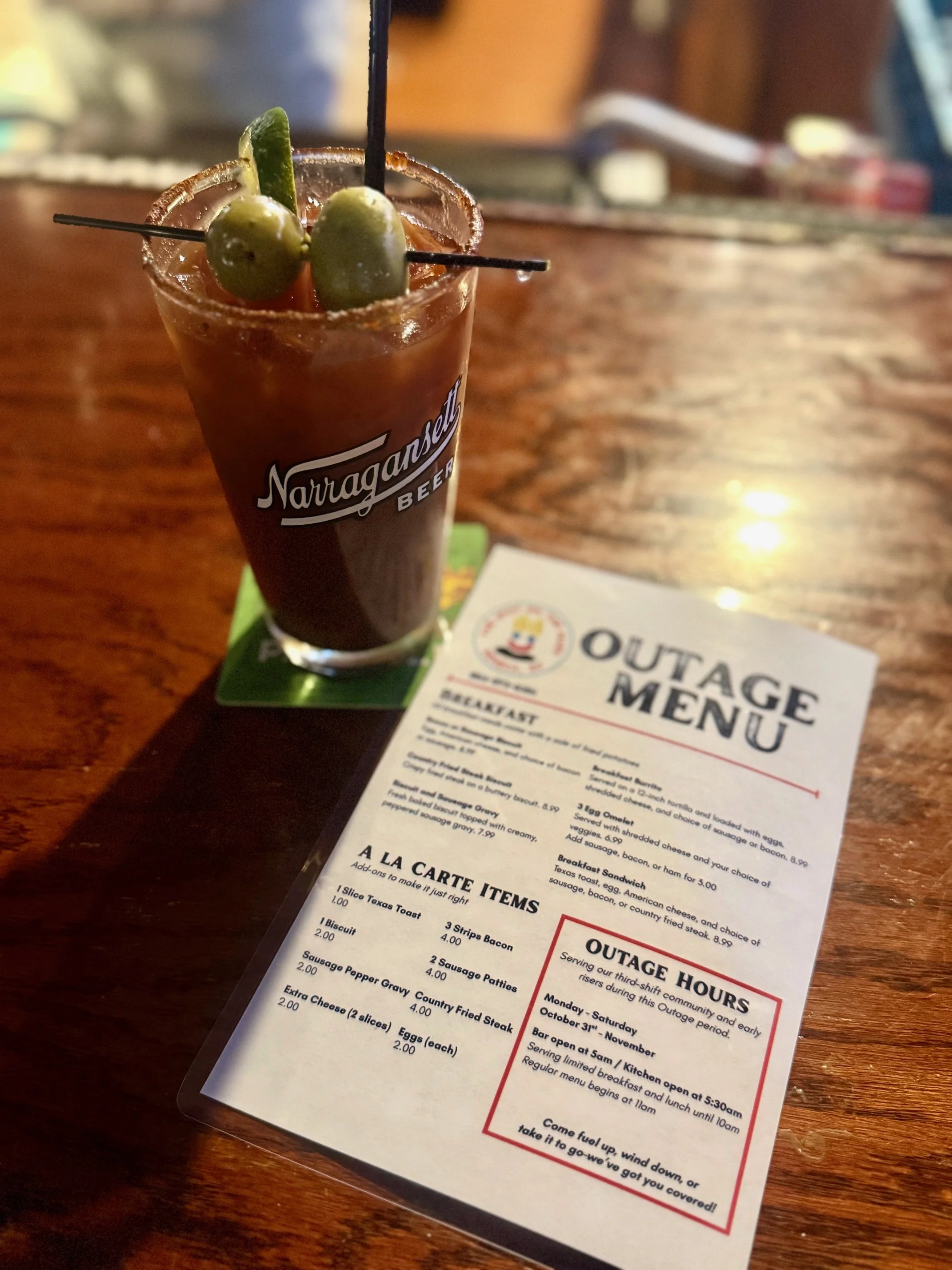 Classic Bloody Mary cocktail with olives and lime garnish