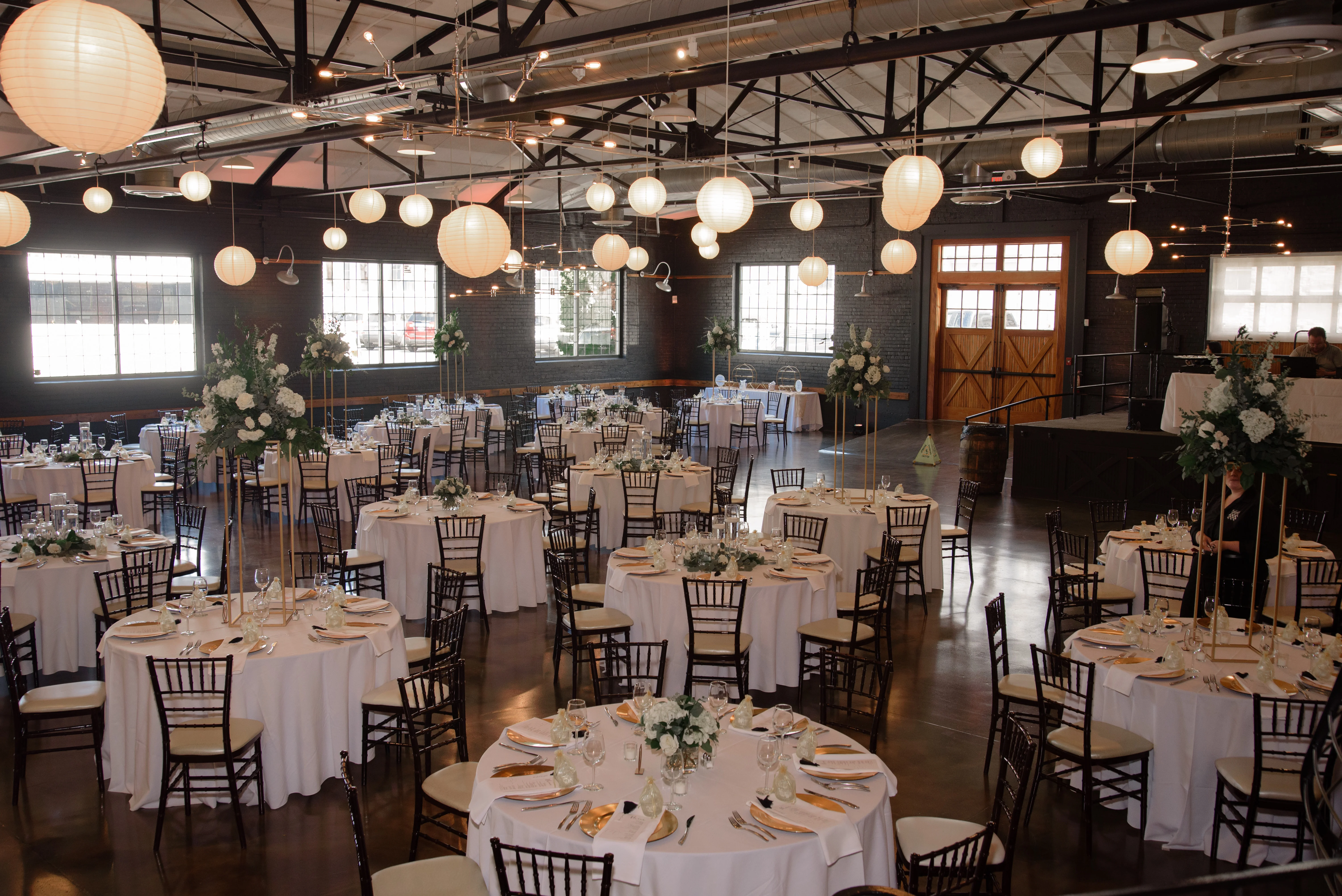 A festive gathering with guests dancing and celebrating. Sparkler wands illuminate the night, creating a joyful atmosphere.