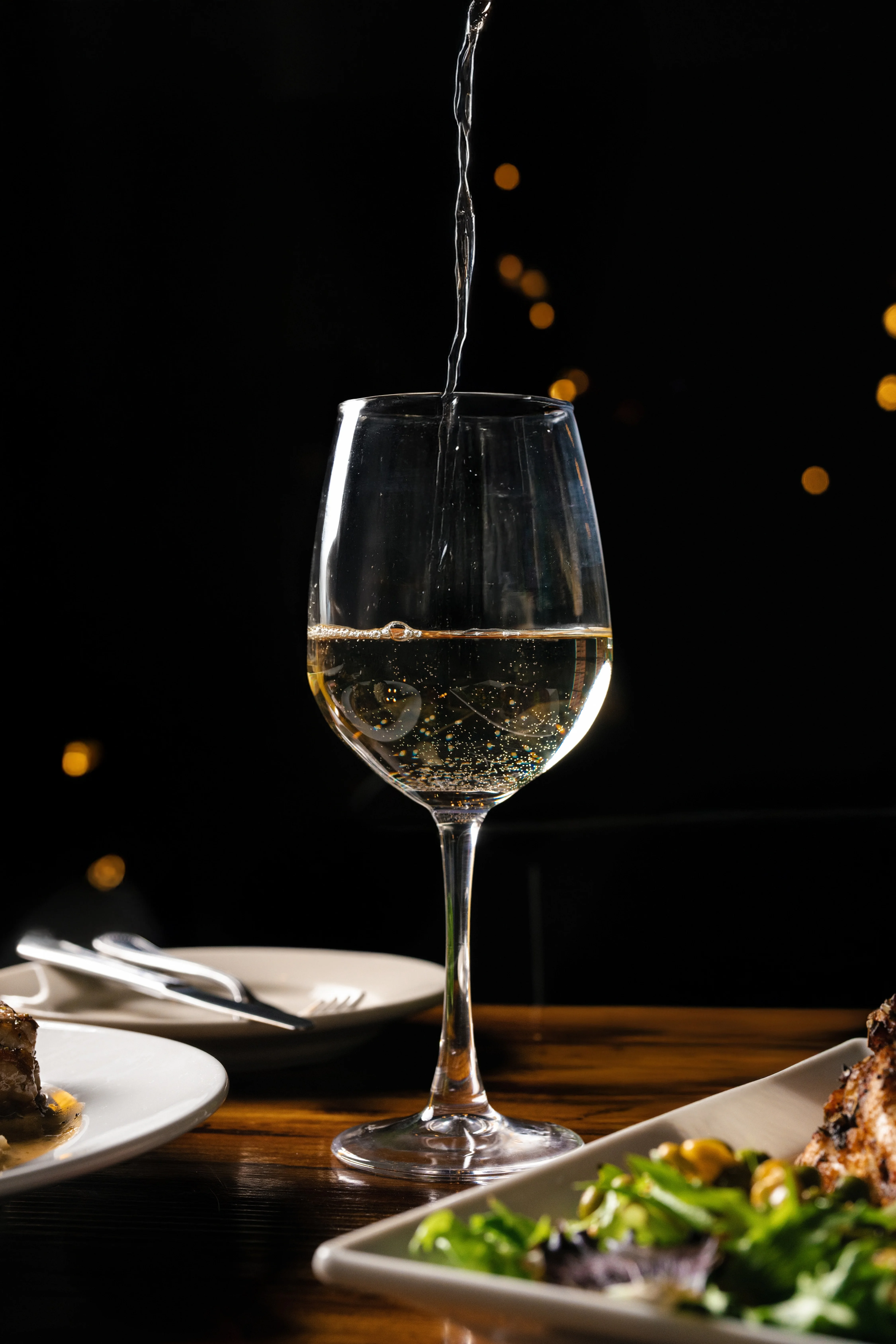 Pouring sparkling wine into a glass