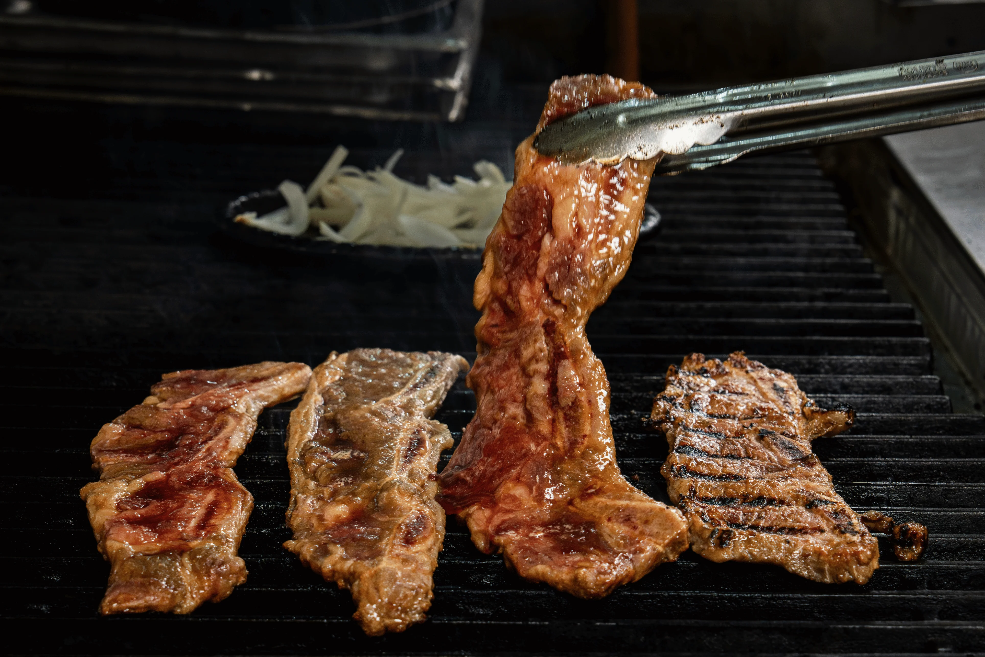 Grilled Korean galbi beef short ribs on a barbecue grill