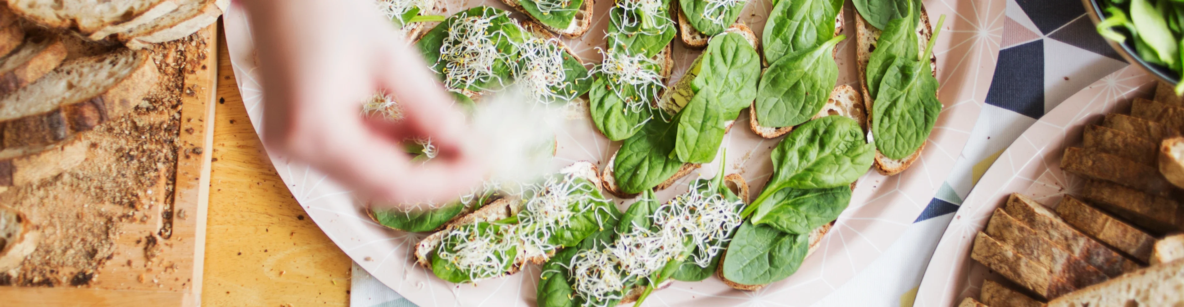 Open-faced spinach sandwiches on whole grain bread
