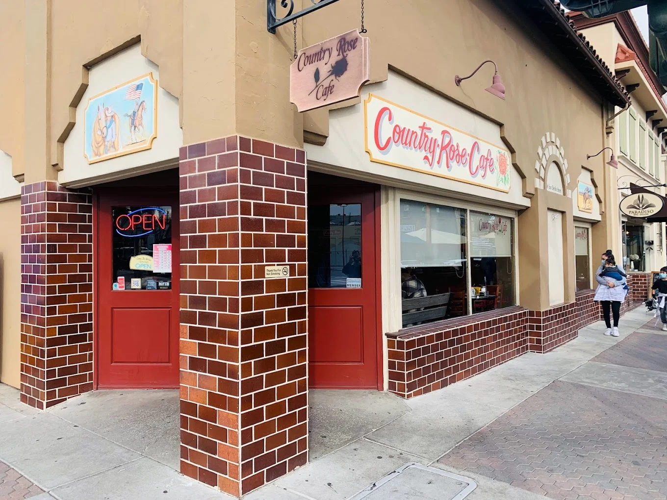 Charming exterior of Country Rose Cafe with open sign